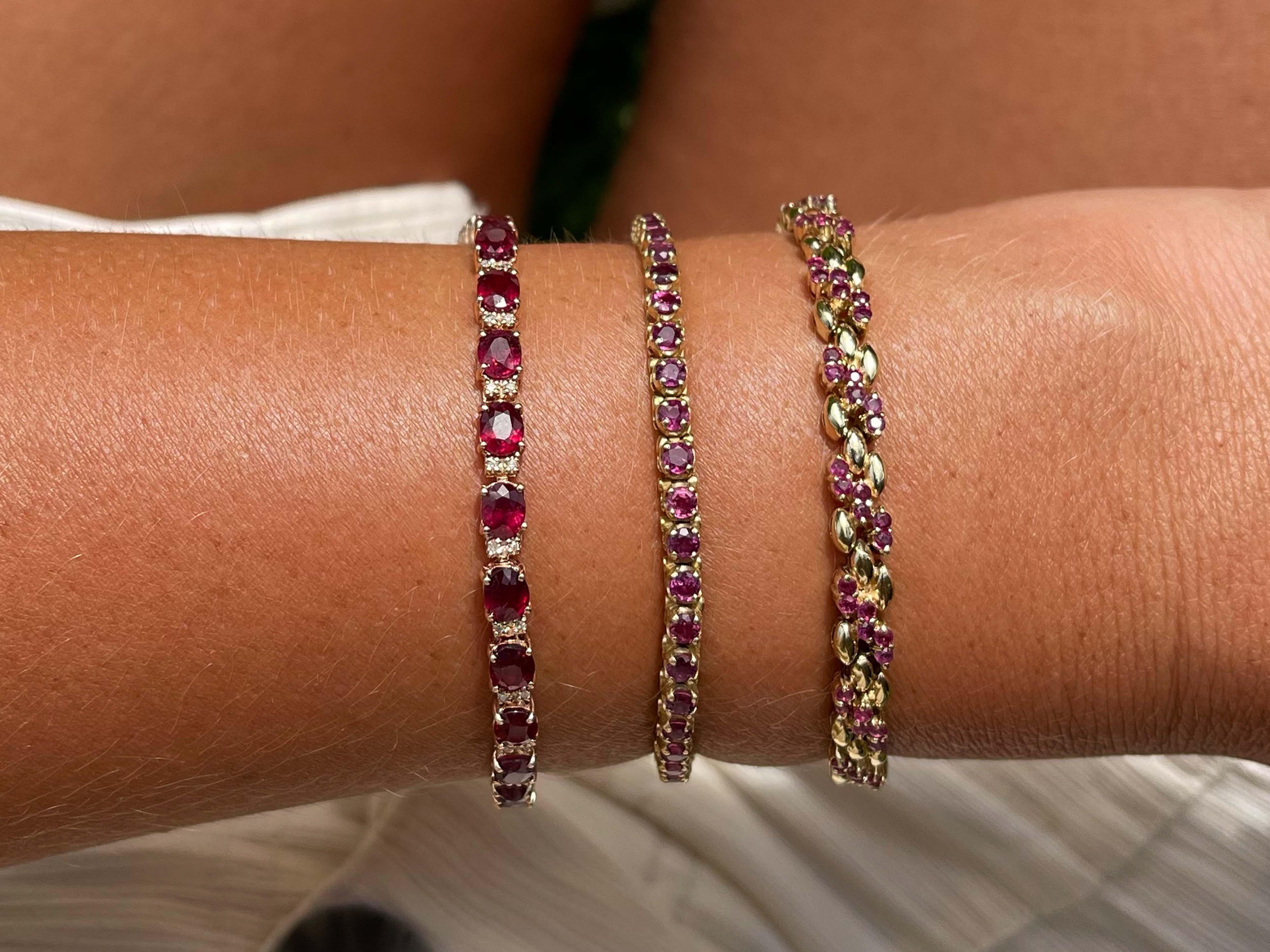 Bracelet Specifications:

Metal: 14k Rose Gold

Gemstones: red rubies 

Red Ruby Carat Weight: 11.5 carats

Red Ruby Count: 28
​
​Diamond Count: 54
​
​Diamond Carat Weight: 0.22
​
​Diamond Color: H
​
​Diamond Clarity: SI

Bracelet Length: ~7.75