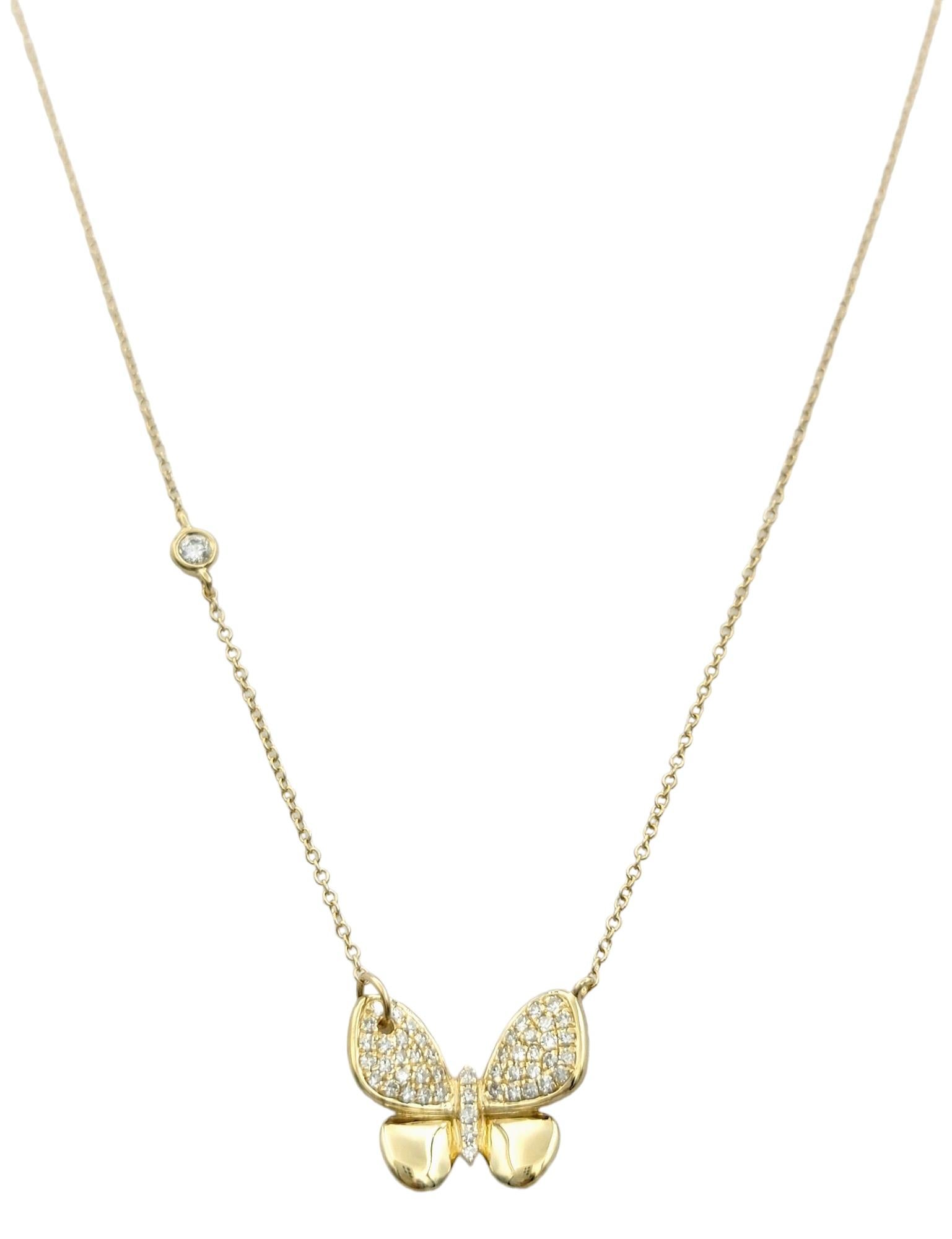 This stunning Effy diamond butterfly necklace, set in 14 karat yellow gold, exudes whimsical charm and elegant sophistication. Its centerpiece, a delicately crafted butterfly pendant, captures the imagination with its graceful form and shimmering