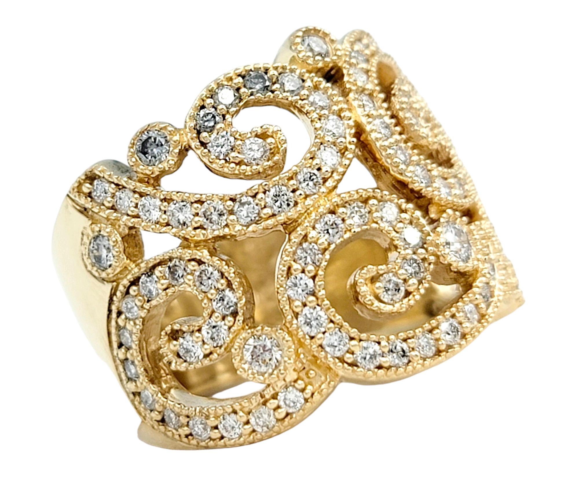 Ring Size: 6.5

This elegant Effy band ring, set in luxurious 14 karat yellow gold, is a stunning piece that seamlessly blends artistry and sophistication. The ring features a scroll-like cutout design adorned with diamonds, creating a captivating