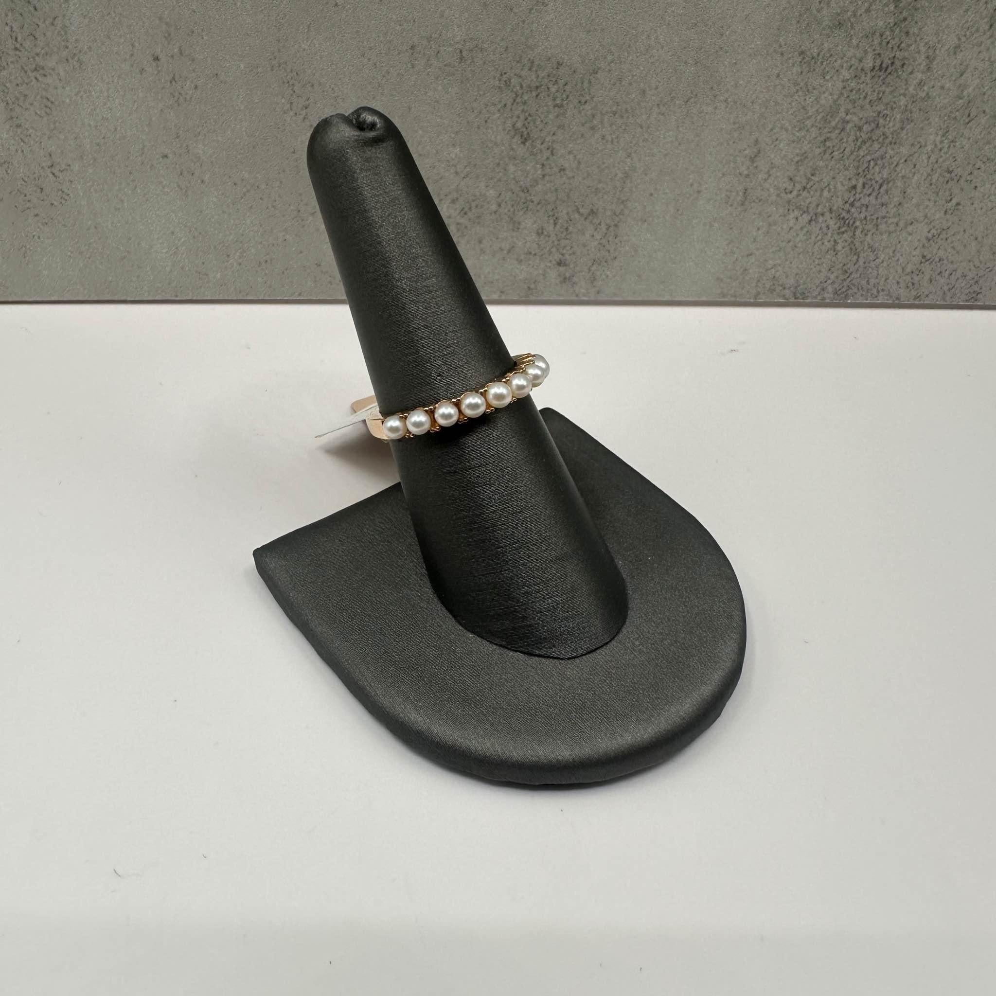This Designer Effy Pearl Ring in 14kt yellow gold features 9 approximately 2.75mm freshwater pearls, offering a classic and elegant design. Weighing 3.1 grams, this ring is both substantial and comfortable for daily wear. Sized at 7, it fits most