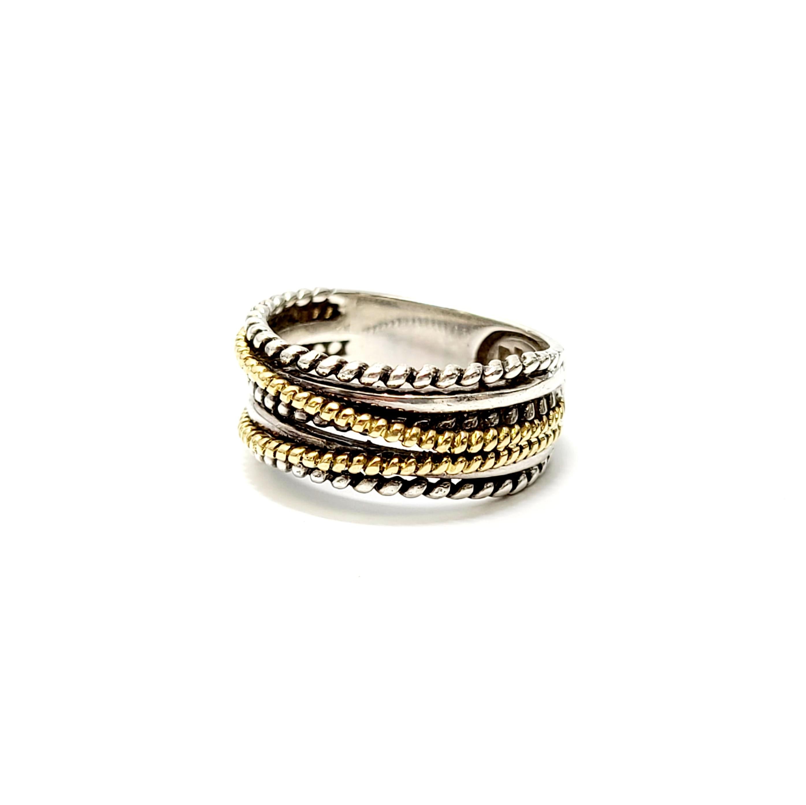 Effy Sterling Silver and 18K Yellow Gold Band Ring

This authentic Effy ring is a size 6.75

Features a twist rope design with 18K yellow gold accents on a sterling silver band.

Front of ring measures 8-9mm in different places.

Stamped EFFY 18K