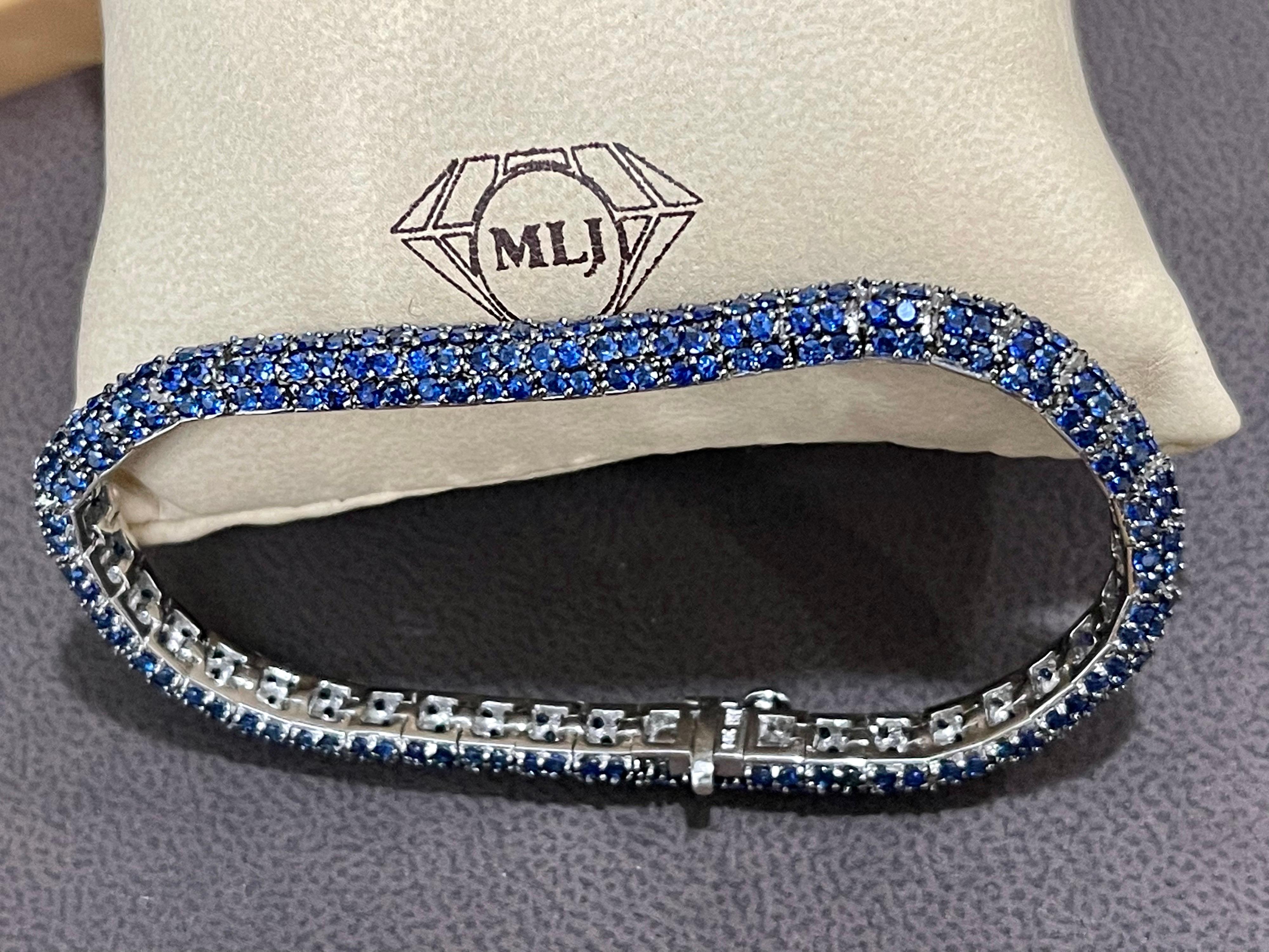  This exceptionally affordable Tennis  bracelet has  Multiple stones of  Blue Sapphires.
 Total weight of Sapphire is  13.5 carat. 
The bracelet is expertly crafted with 21.8 grams of  14 karat gold . Have a safety clasp.
Standard 7 inch long.

Any