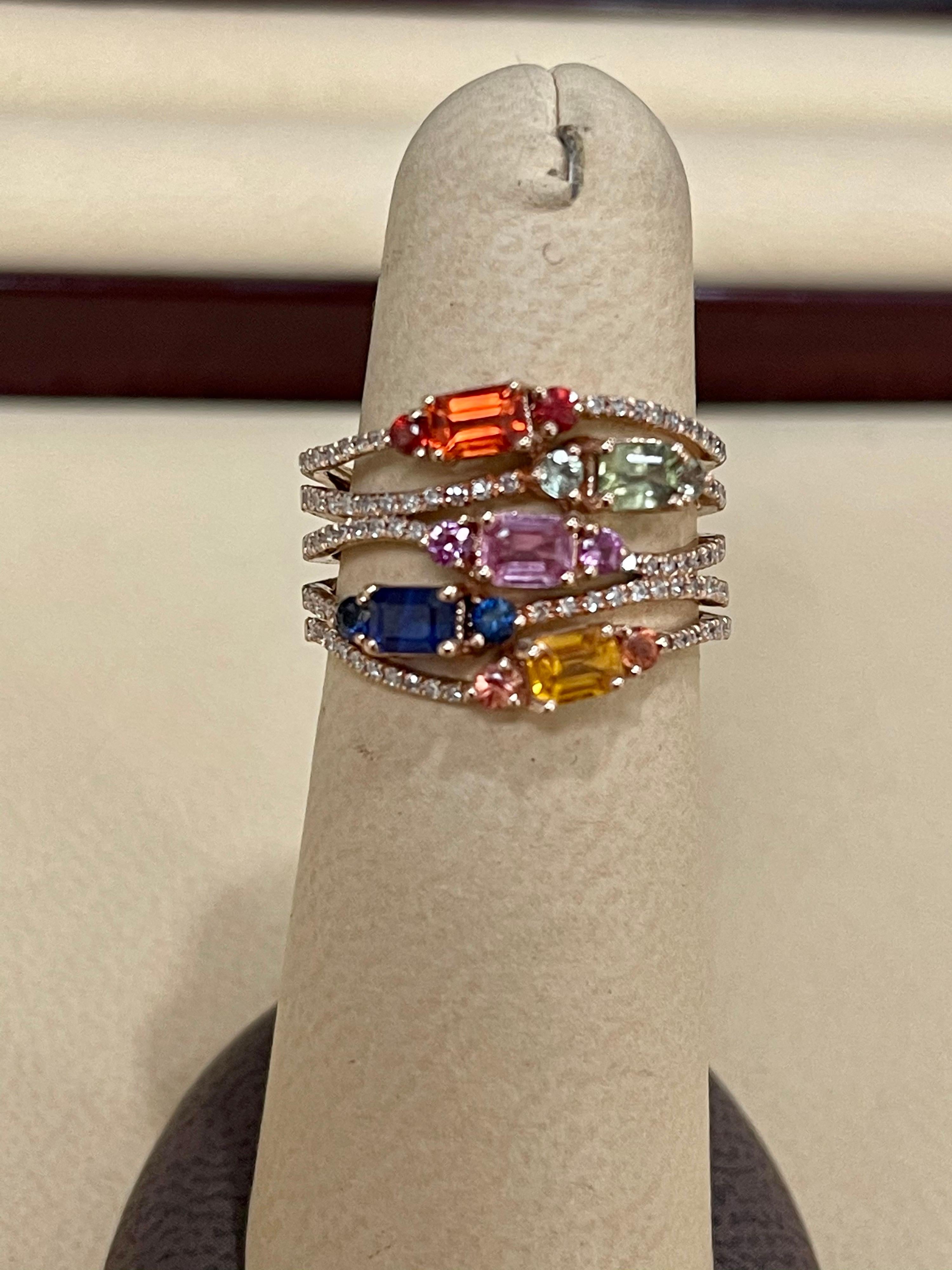 Designer Effy's 1.65 Ct Multi Sapphire & 0.33 Ct Diamond Cocktail Ring in 14 Karat Gold
Round Brilliant cut diamond 88  piece 0.5 pointer and 0.3 pointer  each
14 Karat yellow Gold 5.6 Grams
1.65 Ct Natural  Sapphire  , Green Sapphires, Orange