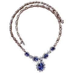 Effy
s 5.5 Carat Oval Natural Tanzanite 
2.2 Ct Diamond Necklace 14 Karat Gold