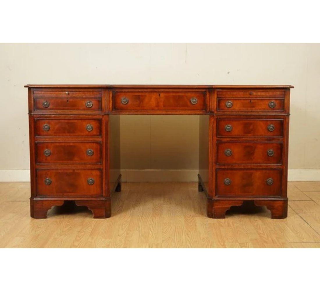 We are delighted to offer for sale this stunning reverse breakfront twin pedestal partner desk handmade in England by the Skilled Craftsman E.G Hudson.

A very well-made and very solid desk. The timber is sublime flamed hardwood, it is book cut,