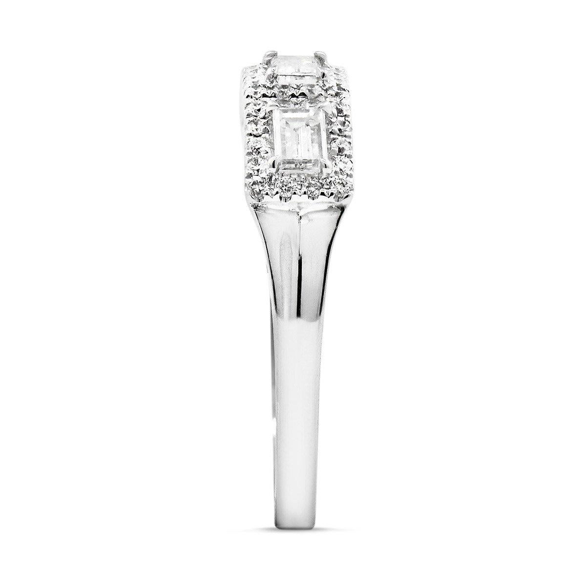 This elegant piece consists of baguette shaped natural untreated white diamonds surrounded by smaller white diamonds making up a total carat weight of 0.56. This piece has been expertly crafted using 18 karat white gold and is EG Lab certified.