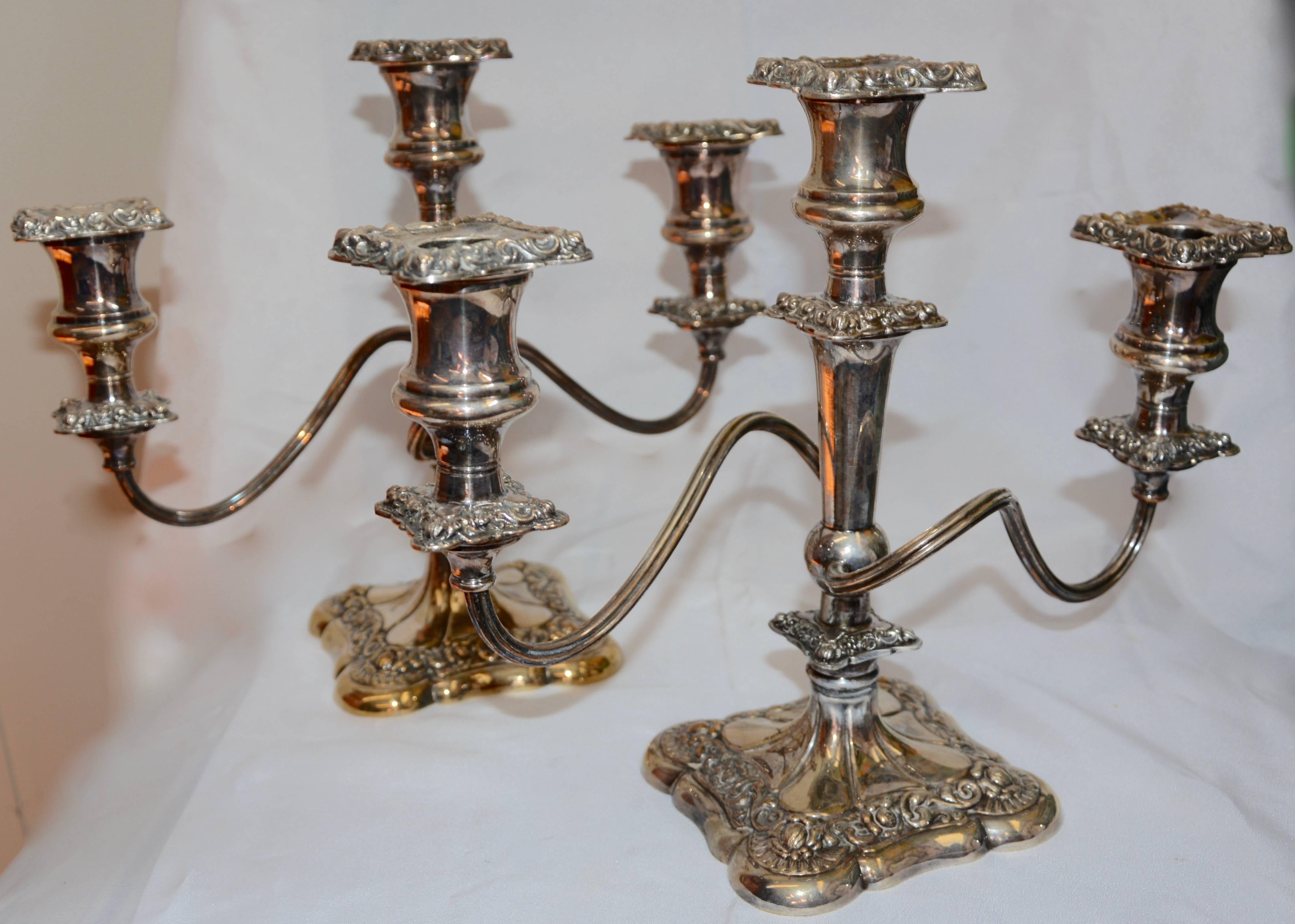 Featured is a fabulous pair of candelabras by Elizur G. Webster and Sons of International Silver Co. Each candelabrum features three arms with two of those mounted on gracefully curved arms. The details on these pieces have been very well done.