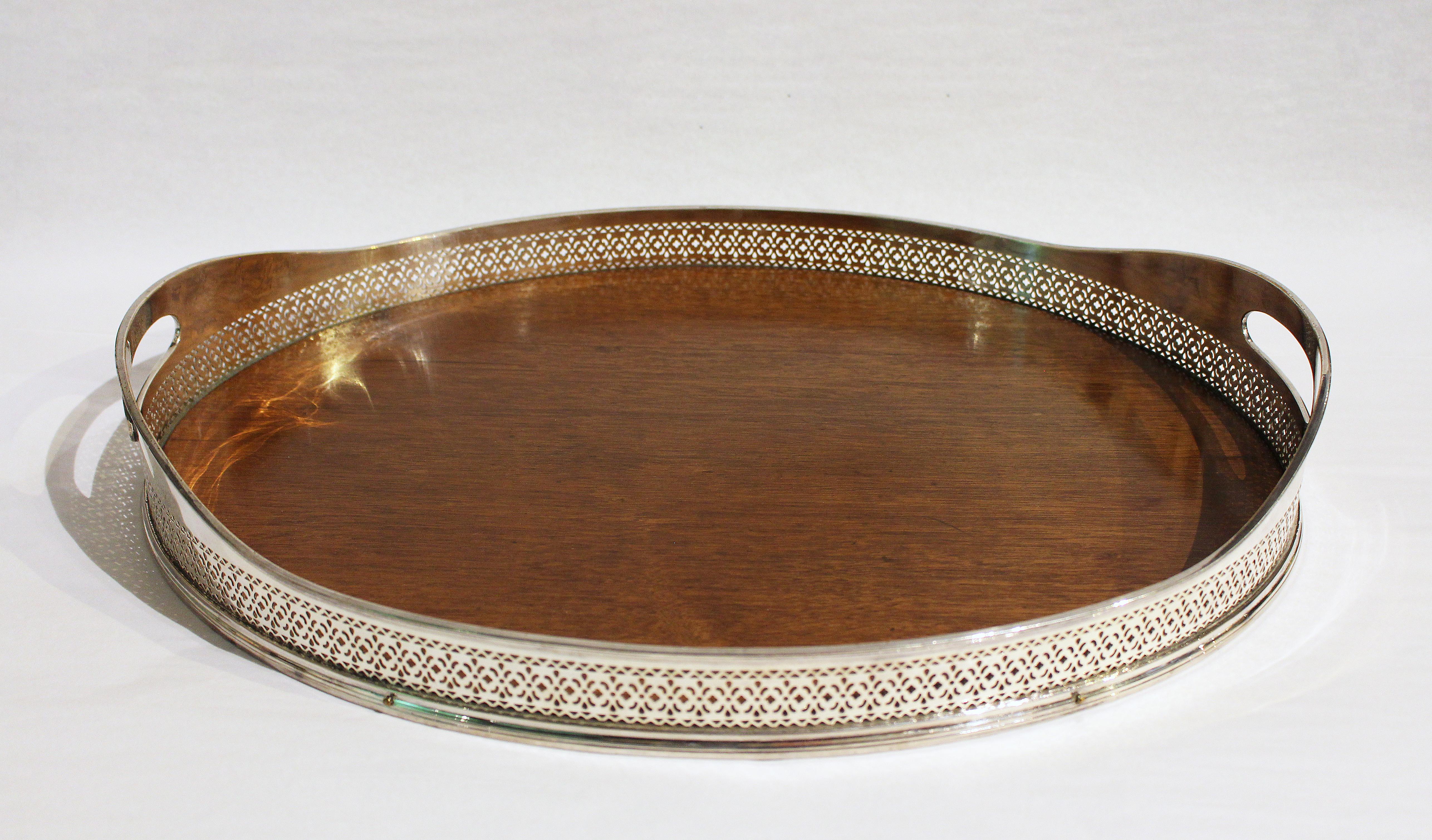 A very fine American silver on nickle tray with reticulated gallery and mahogany base. EG Webster and Son, 1886-1928. 18 1/4