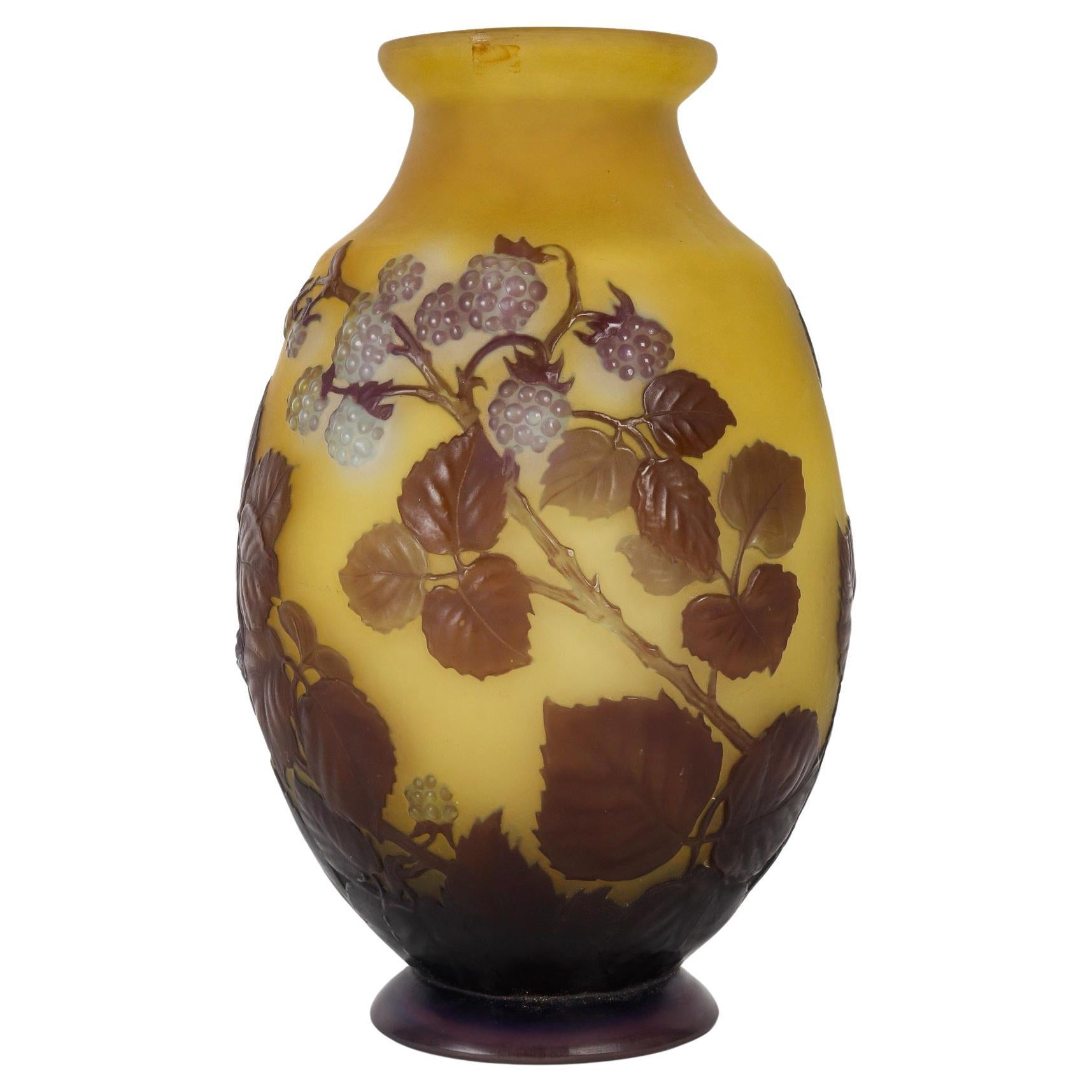 Émile Gallé (1846-1904)
French Art Nouveau Cameo Mold Blown Glass Vase « Framboiser » circa 1910
French mold blown cameo glass in dark blue over yellow with raspberry decoration.
Marked and underlined in cameo 'Gallé', with the «e» greek