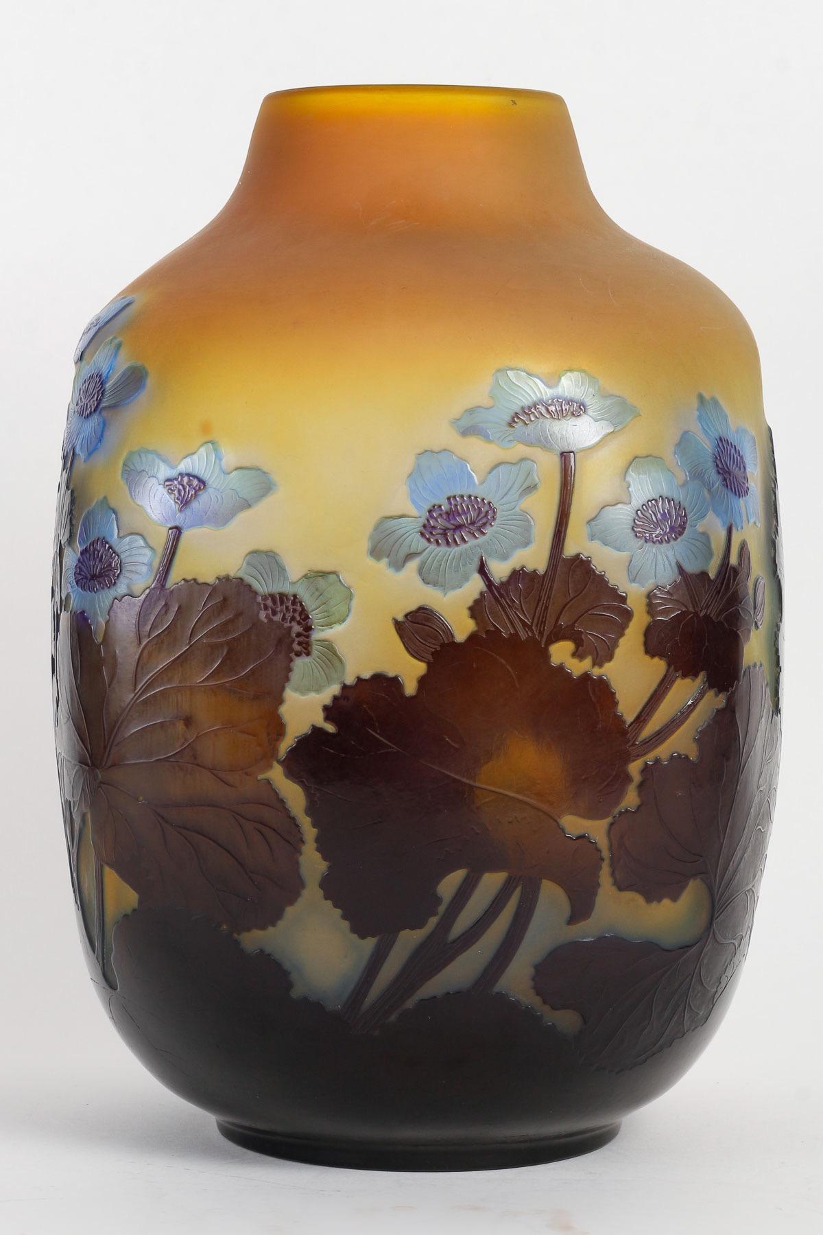 Émile Gallé (1846-1904)
French Art Nouveau Caméo Glass Vase « Anemones » circa 1900

Rare Galle French cameo glass vase in dark blue over yellow 
Blue Anemones flowers design 
Signed in cameo Gallé

Émile Gallé was born in Nancy on 4 May 1846, the