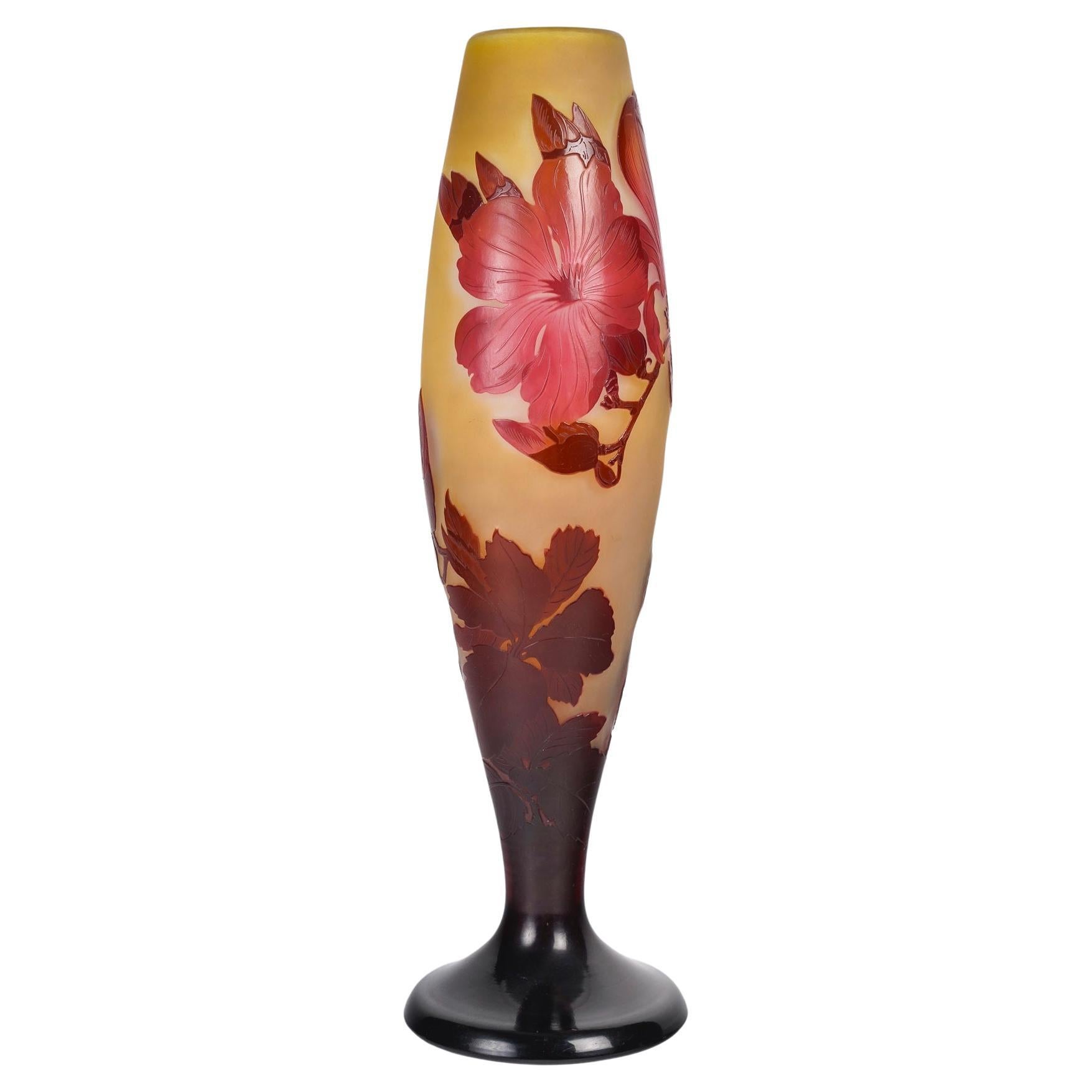 Émile Gallé (1846-1904)
French Art Nouveau Caméo Glass Vase «Magnolias » circa 1900

A multilayer deep red and yellow glass vase with acid-etched and wheel-engraved decoration.
Designed with Magnolias, foliated and flowery branches, 
Signed in Cameo