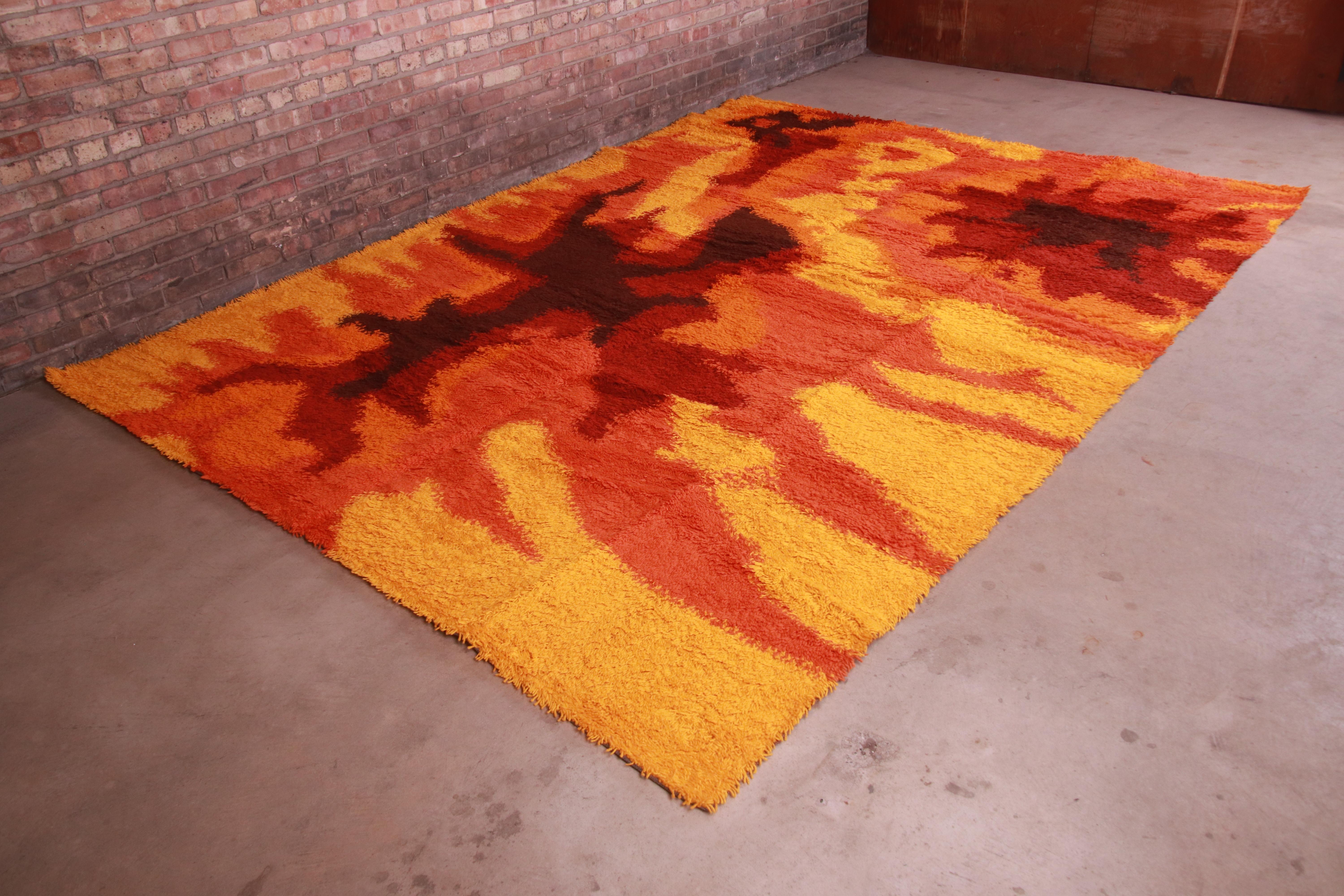 An outstanding mid-century Danish Modern Rya shag wool rug

By Ege Rya

Denmark, 1970s

Thick wool pile, with vibrant colors in orange, red, gold, and brown.

Measures: 8'2