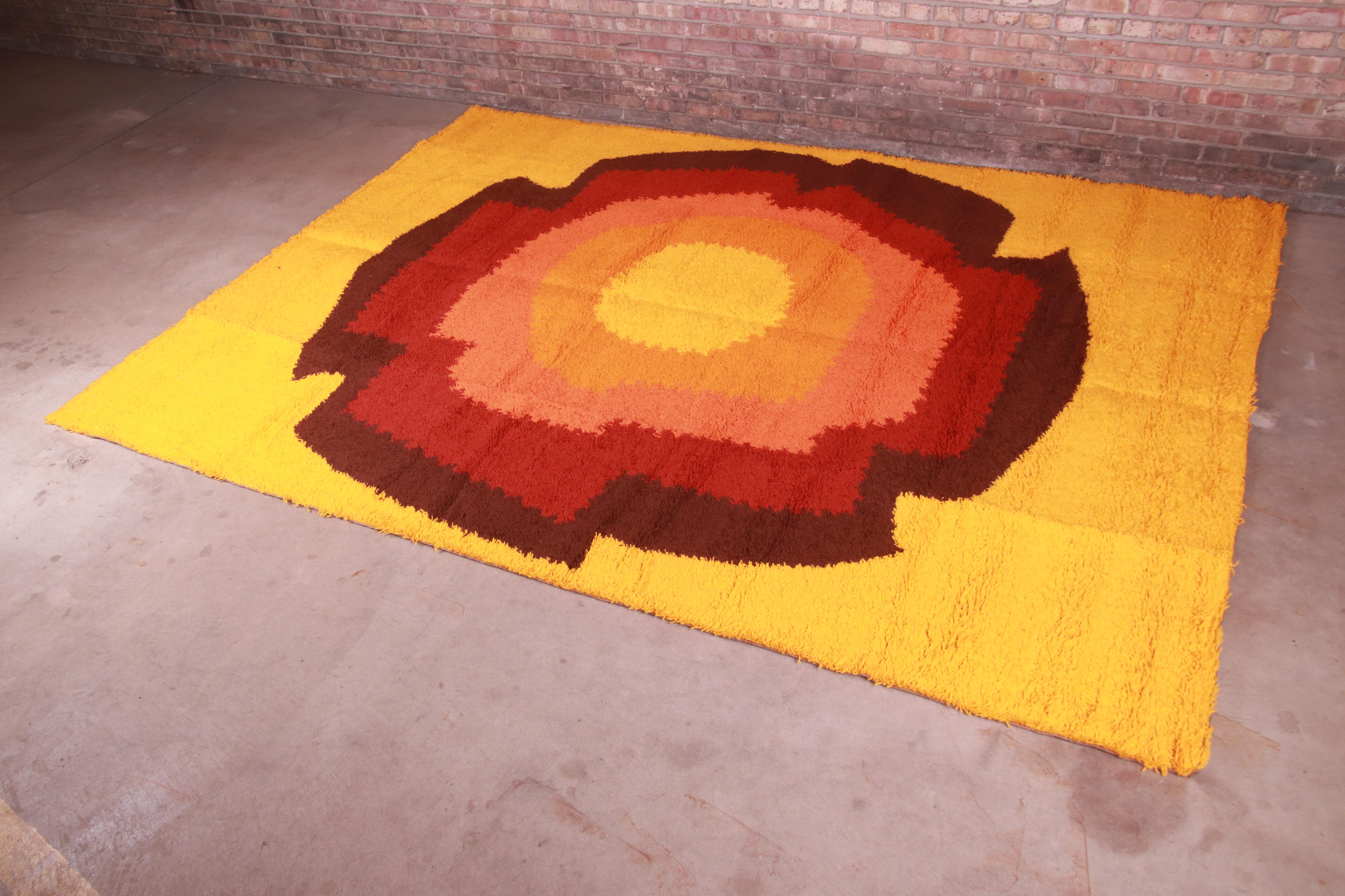 An outstanding mid-century Danish Modern Rya shag wool rug

By Ege Rya

Denmark, 1970s

Thick wool pile, with vibrant colors in gold, orange, red, and brown.

Measures: 8'2