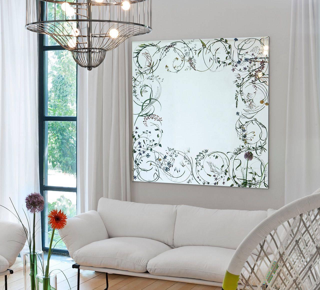 Wild herbs moved by a delicate breeze, frame, lightly and gently, a square mirror, making any space a place in which one can enjoy elements of nature.