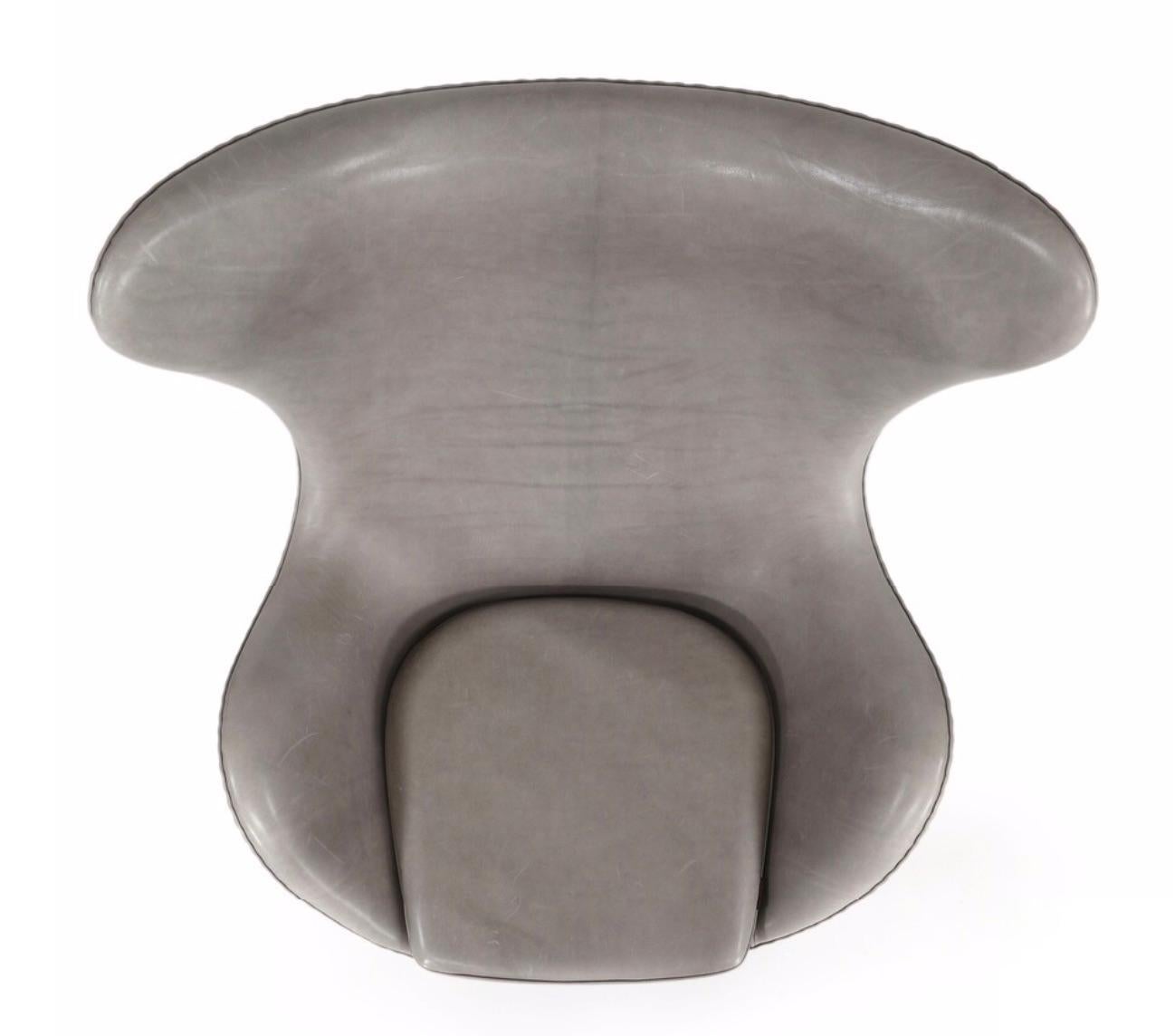 “The Egg Chair”. Easy chair with tilt function. Swivel base of aluminum. Seat, sides and back upholstered with grey leather(embrace, concrete). Model 3316. Designed 1958. Manufactured and marked by Fritz Hansen. 

Stamped serial number: