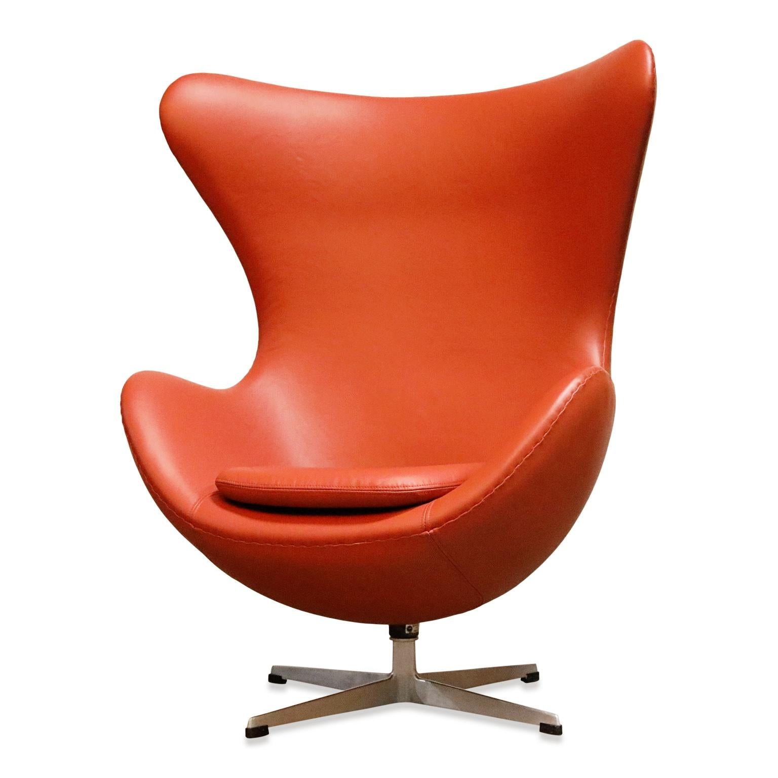 A wonderful signed and dated (Fritz Hansen, November 1963) early production original and authentic example of Arne Jacobsen for Fritz Hansen Egg chair. 

This classic and timeless chair has been recently reupholstered in a burnt orange colored