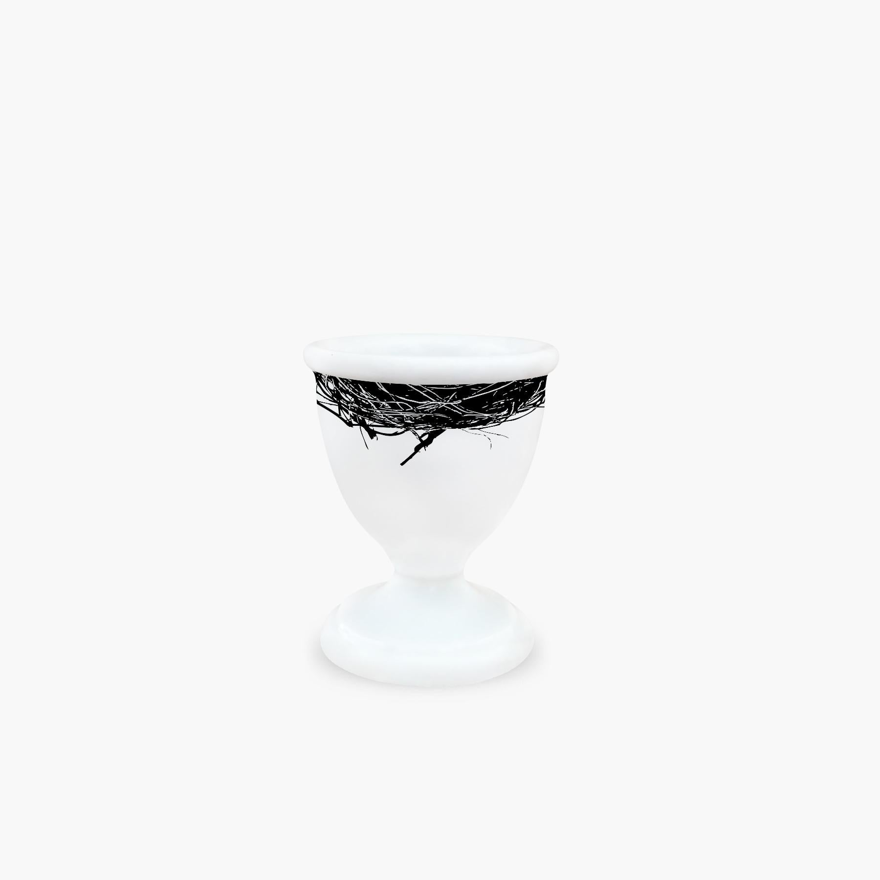 Just out of its nest, here is our first egg cup, for hot mornings with just bread and butter, endless brunches, or fancy dinners with recipes from great chefs. 

Egg cup in extra fine porcelain, white, silk-screen printed and hand laid.
Measures: