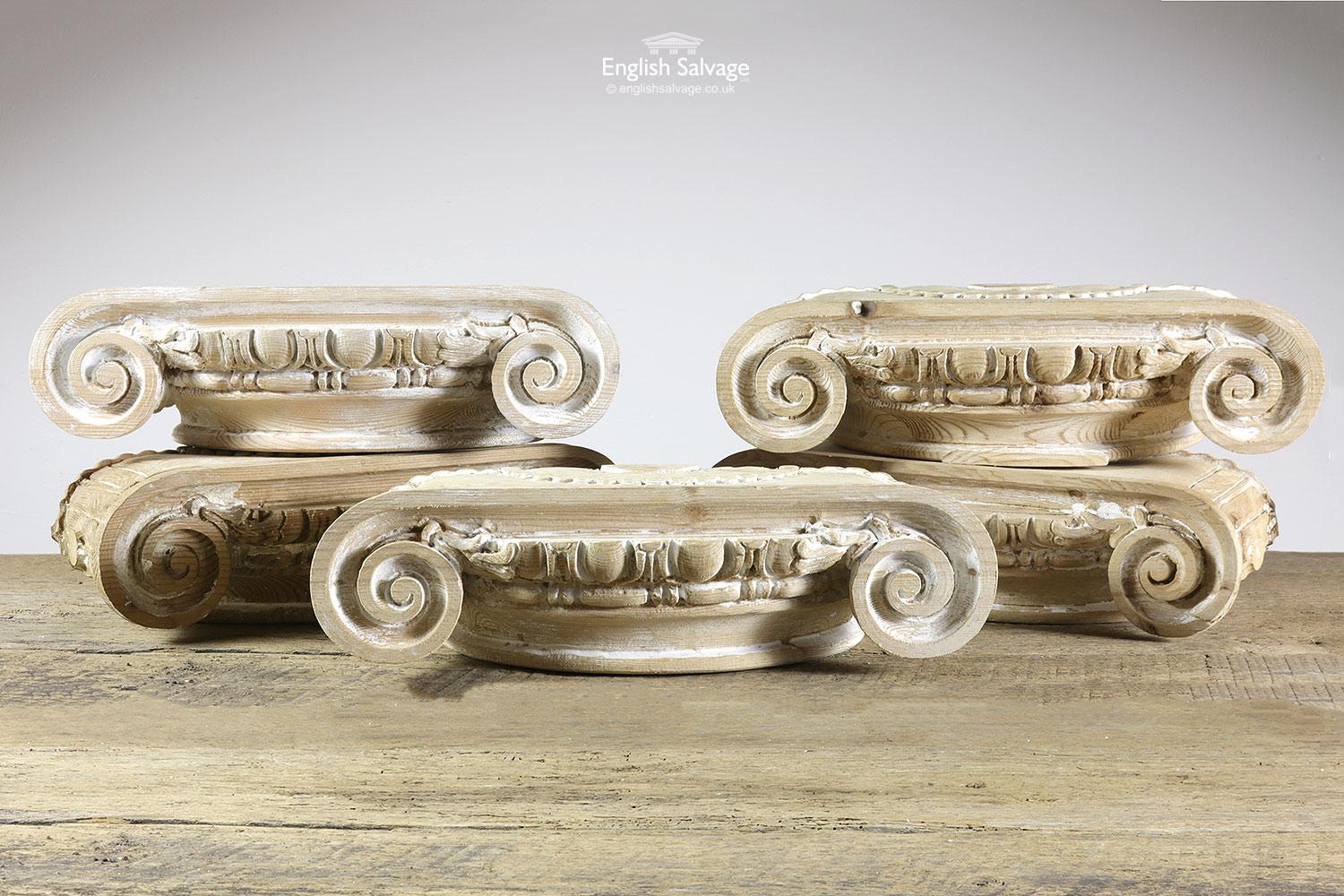 Reclaimed carved wooden capitals with egg and dart detailing between the scrolled ends and a semi-circular beading detail along the top. Few splits and dings to edges.