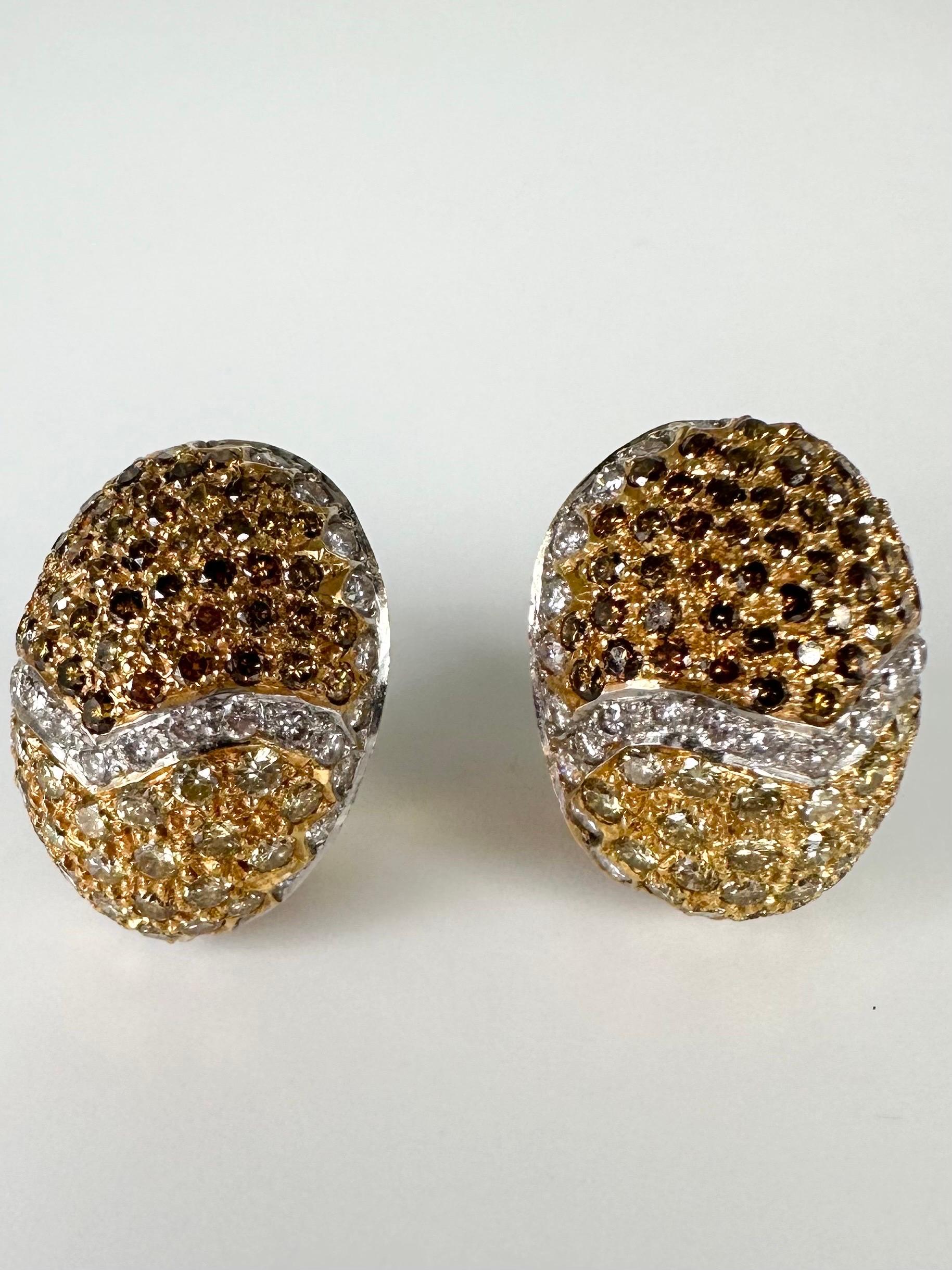 Easter egg diamond earrings made wih fancy brown and fancy yellow diamonds in 18KT yellow gold, these earrings look amazing on ears and are the right size!

GOLD: 18KT gold
NATURAL DIAMOND(S)
Clarity/Color: VS/F
Carat:3.74ct
Cut:Round