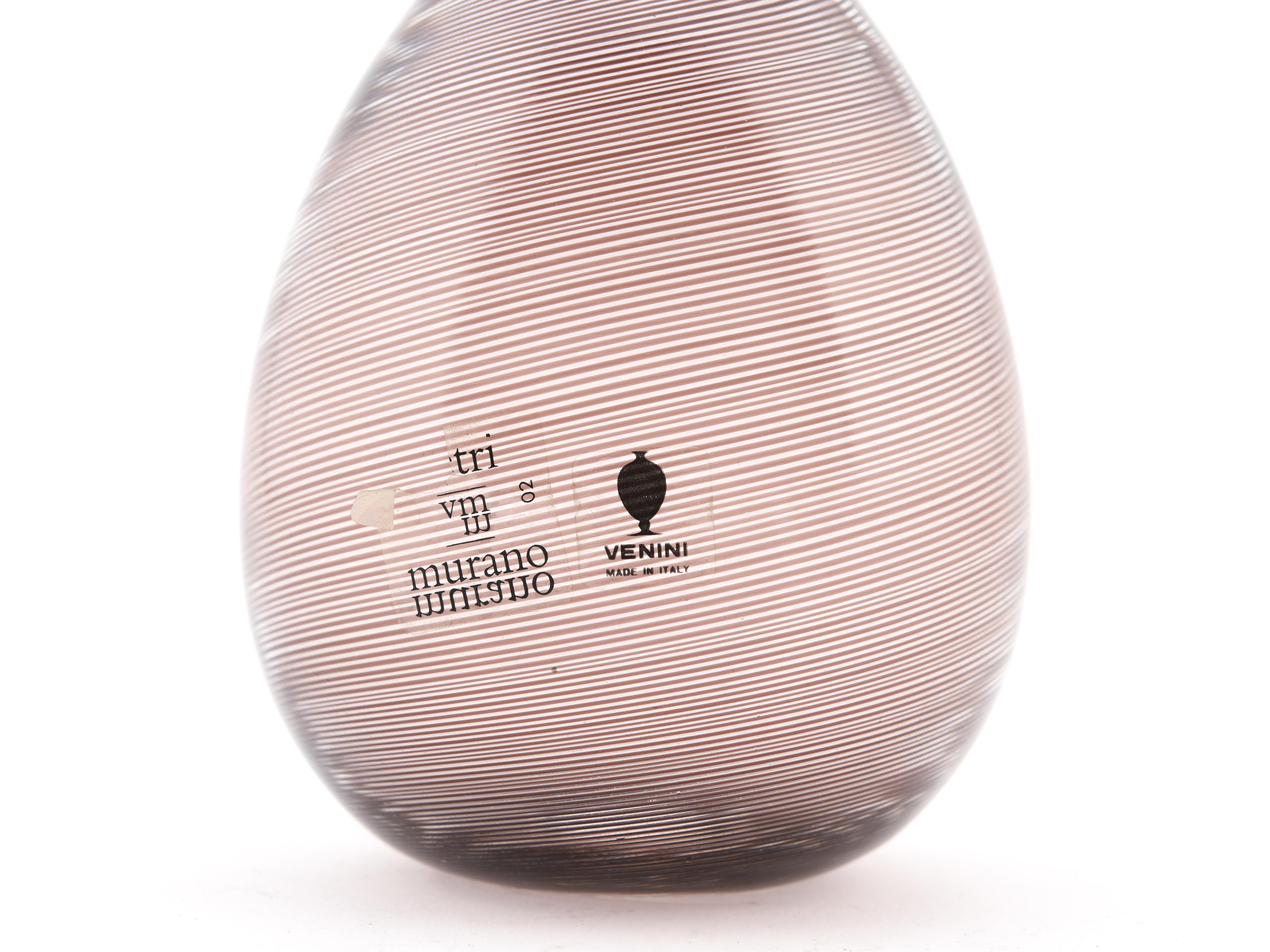 Beautiful blown glass egg(soffiato a mano), from the Venini collection Filigrane, in shades of purple and pink. 
This beautiful example is signed under the base.

Tapio Wirkkala is a Finnish designer and sculptor, widely considered a leading figure