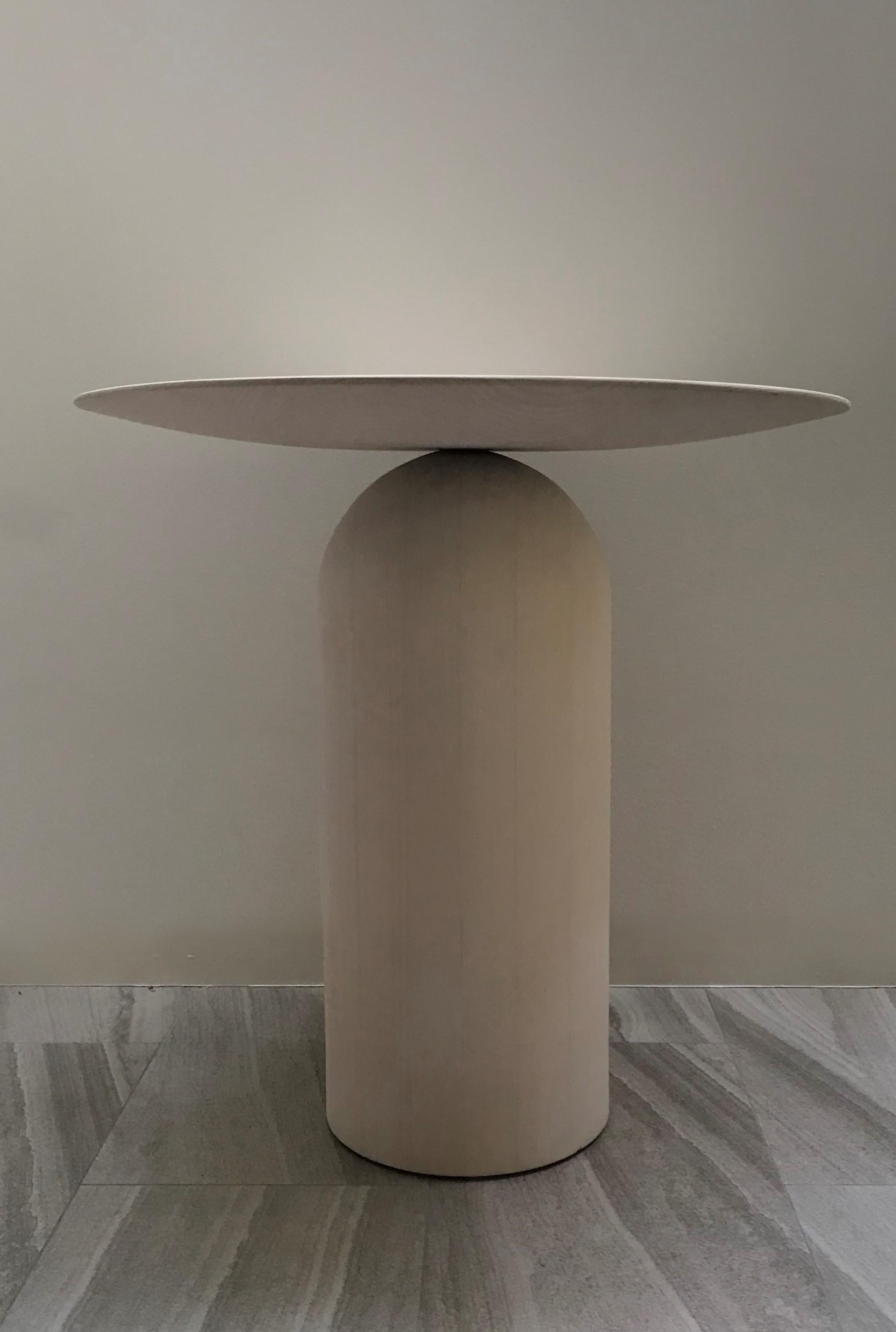 Inspired by 20th century sculptors, Arp and Brancusi, this artisanal table works equally well in modern or classical interiors. The size shown can be used as a hall table, center table, bedside or coffee tables. EGG tables are truly artisanl, made