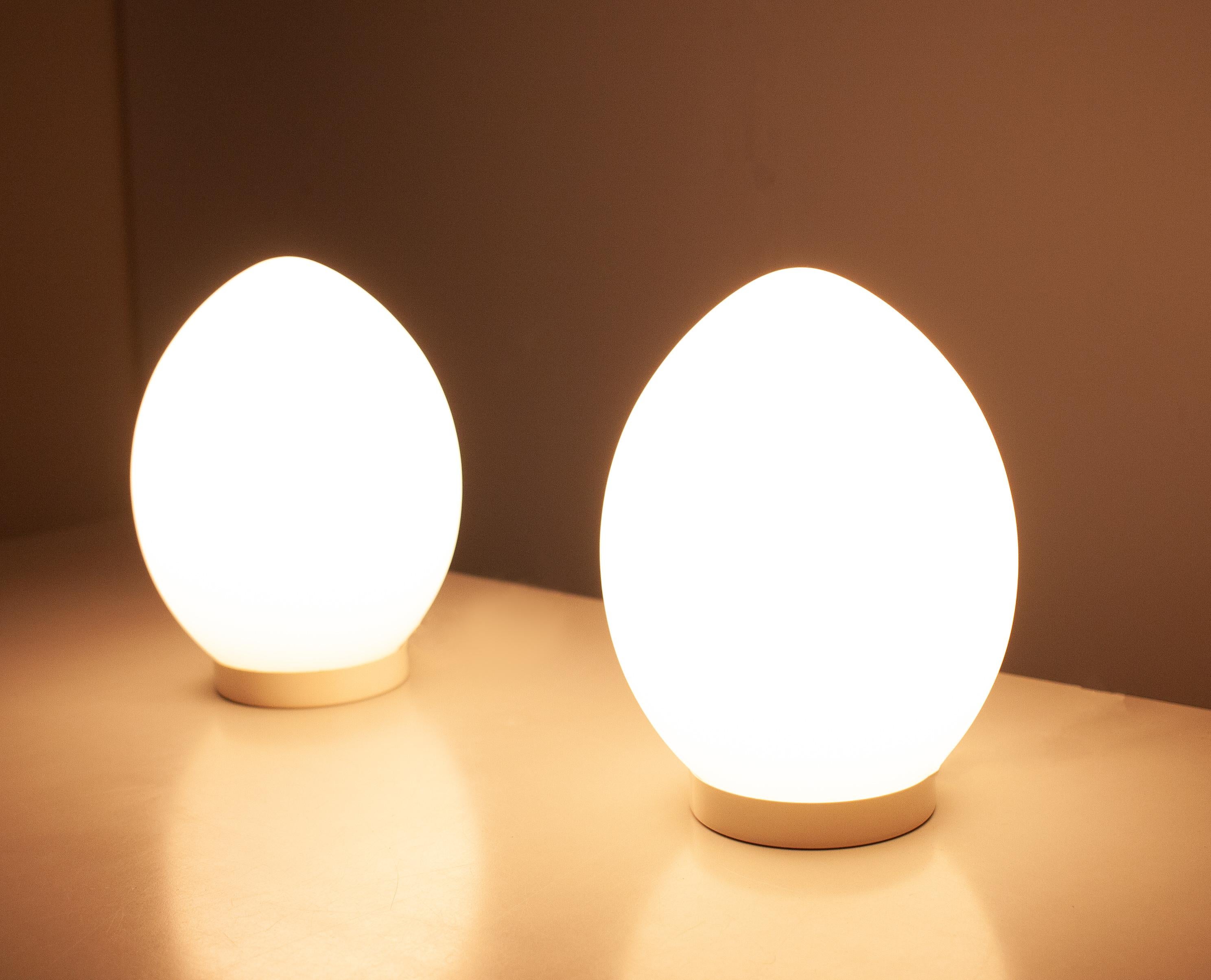 Two beautiful egg-lamps by Verrerie de Vianne France, the sober and simple shape made this design
so strong. Hand blown glass. Satin finished. Signed Vianne One E27 bulb each.