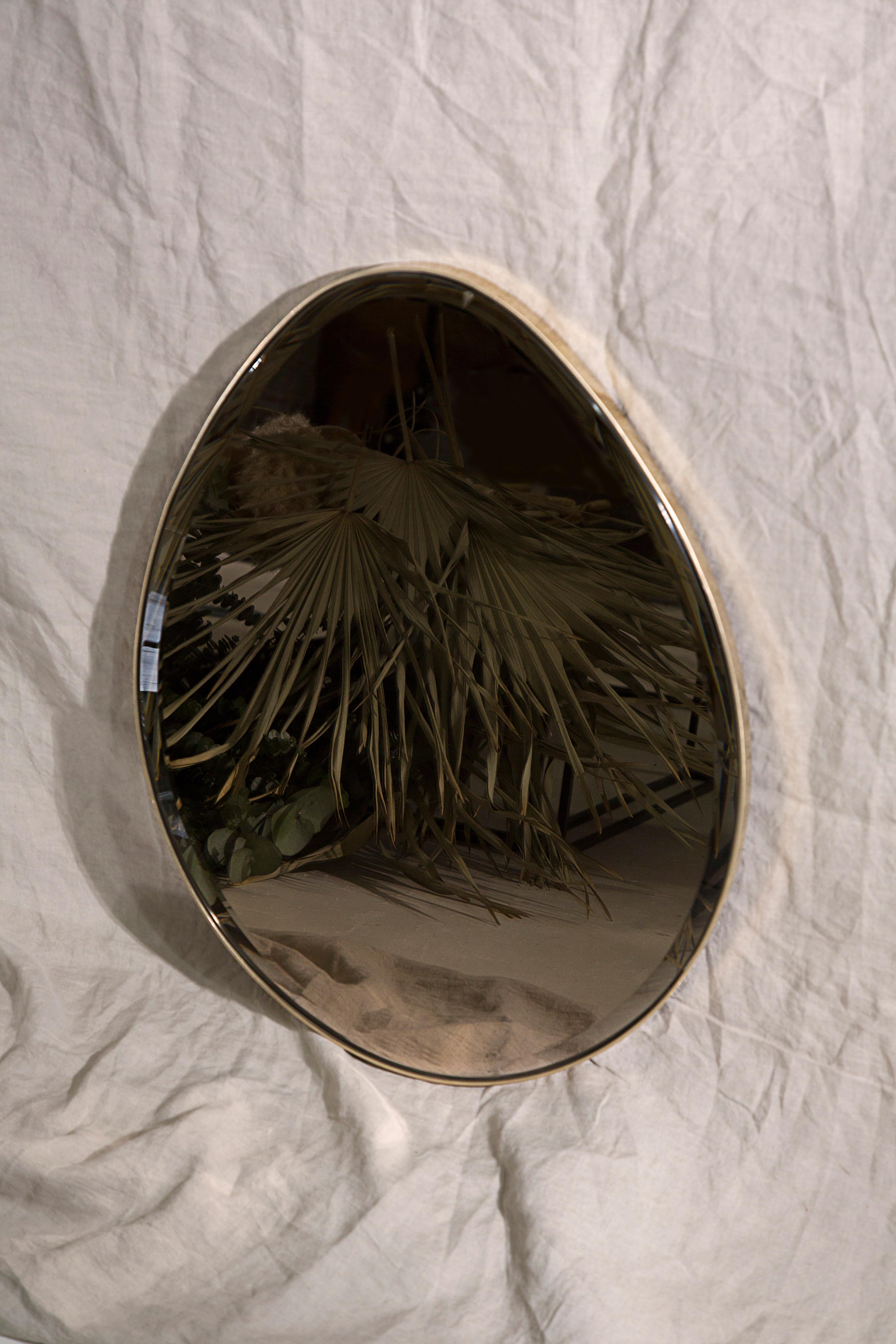 Egg mirror signed by Novocastrian

Wall-mounted egg mirror with polished brass frame. Beveled bronze or grey tinted glass available. Supplied with two screw fixing points to rear face. Handcrafted in the North East, England.

Measures: 450 (W) x