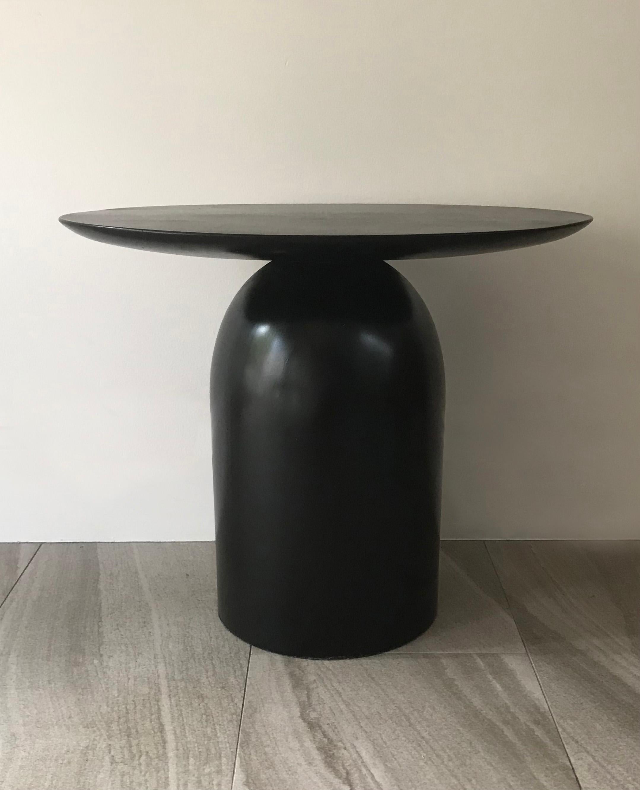 Our EGG Noir side table or coffee table is shown in our original egg table size, approximately 20 inches. EGG tables are truly artisanal, made one piece at a time on a single lathe by master craftsmen in Australia.  Our EGG Tables were inspired by