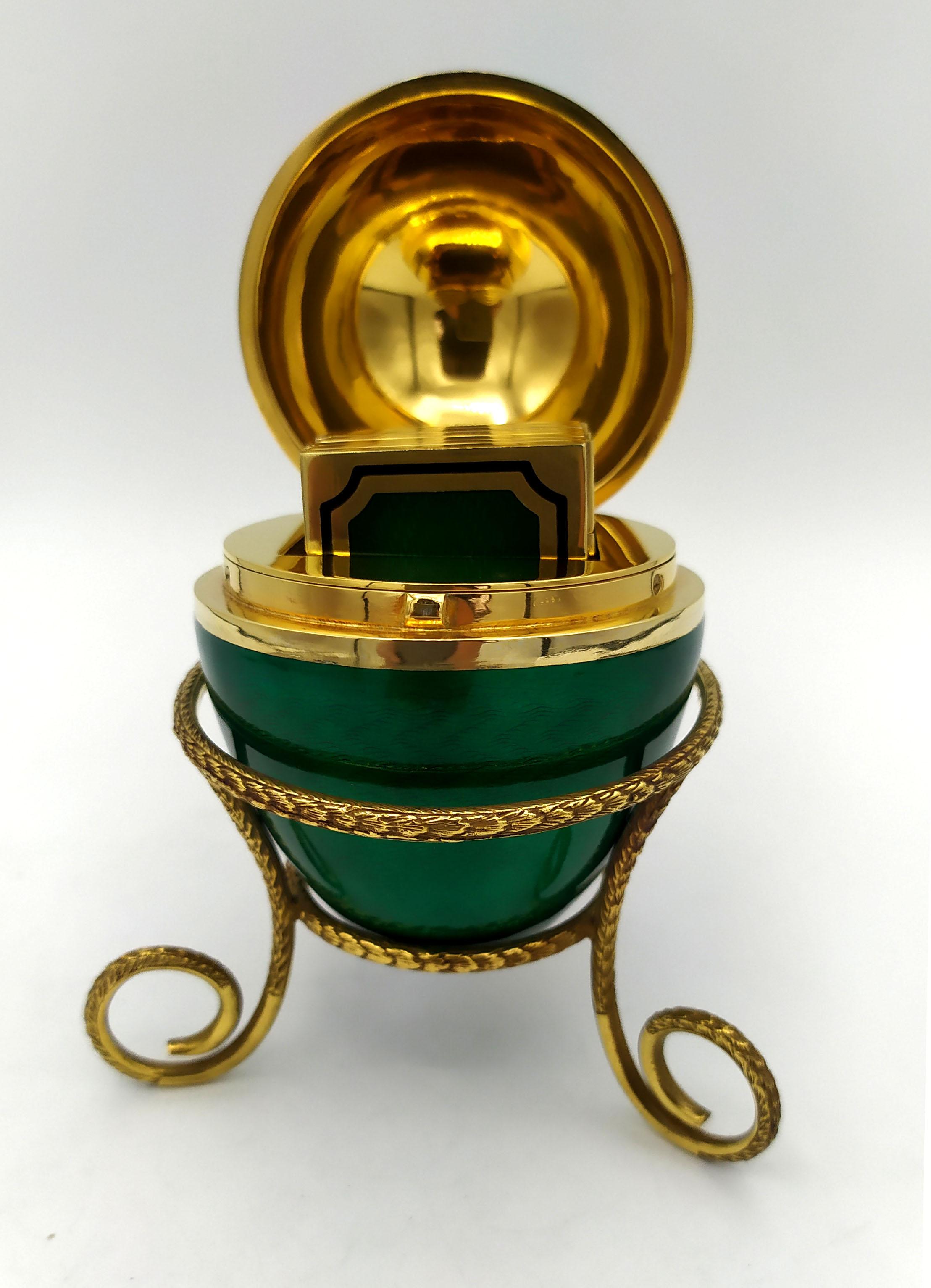 Egg on tripod with folding photo frame for 6 photos, inside, in 925/1000 sterling Silver gold plated, with translucent fired enamels on guillochè. Russian Empire style inspired by Carl Fabergè eggs at the end of the 19th century, early 1900s. Egg