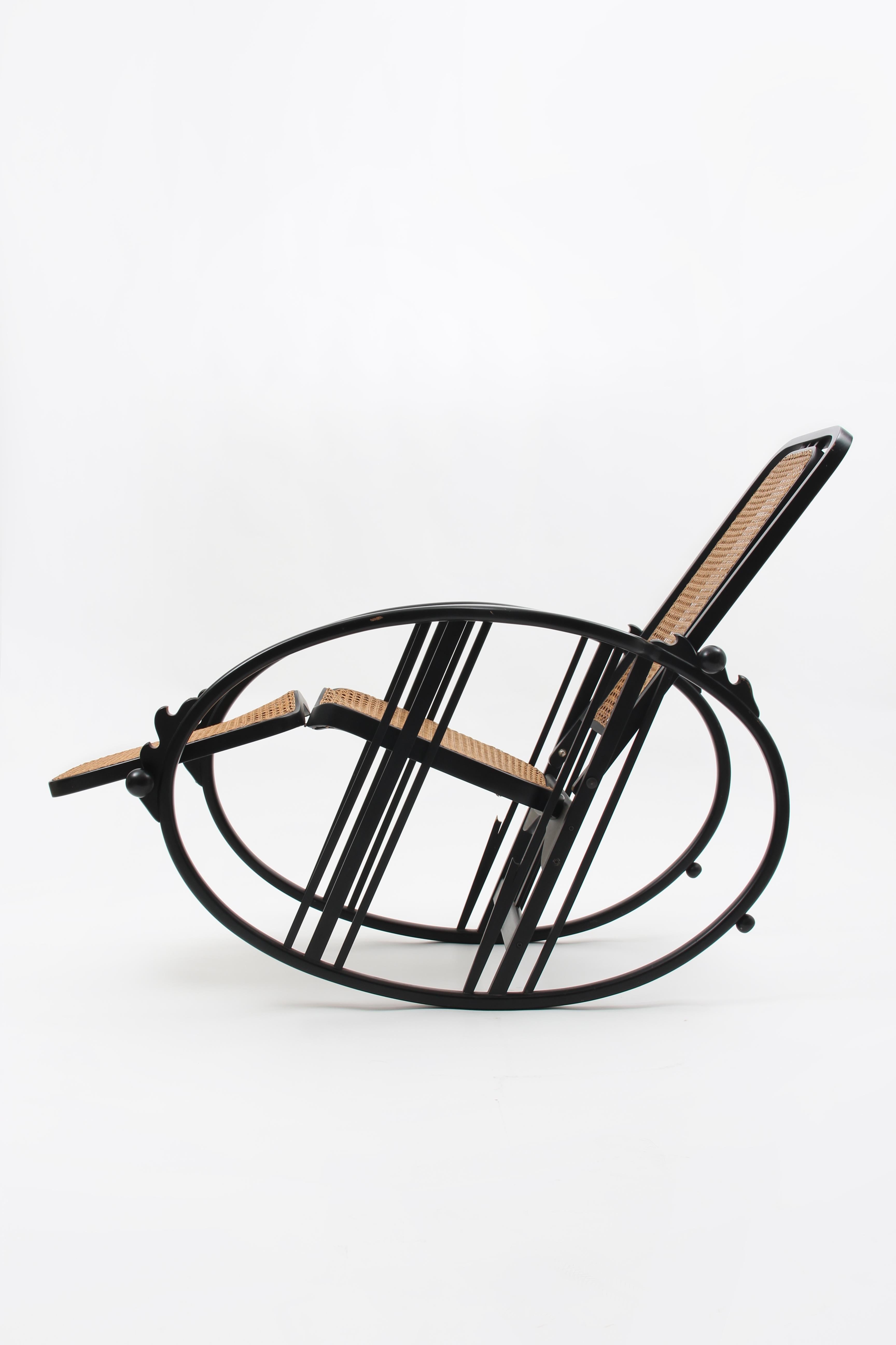 Egg Rocking Chair attributed to Josef Hoffmann for Società Anonima Antonio Volpe, circa 1920.

Breathtaking, rare and elegant rocking chair.
Black lacquered beech bentwood and viennese woven rattan, multi-adjustable backrest and the fold-out