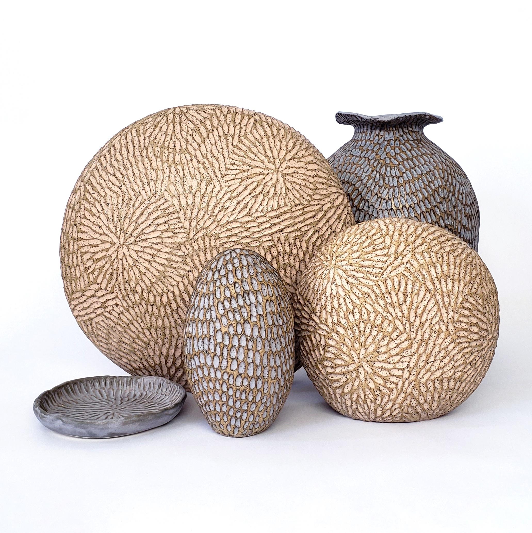 Handbulit ceramic sculpture by Demetria Chappo. This 6in sculpture sits nicely on a desk, tabletop, bookshelf or grouped with other sculptures. Its tactile qualities and small size allow for holding and enjoying the meditative properties of the