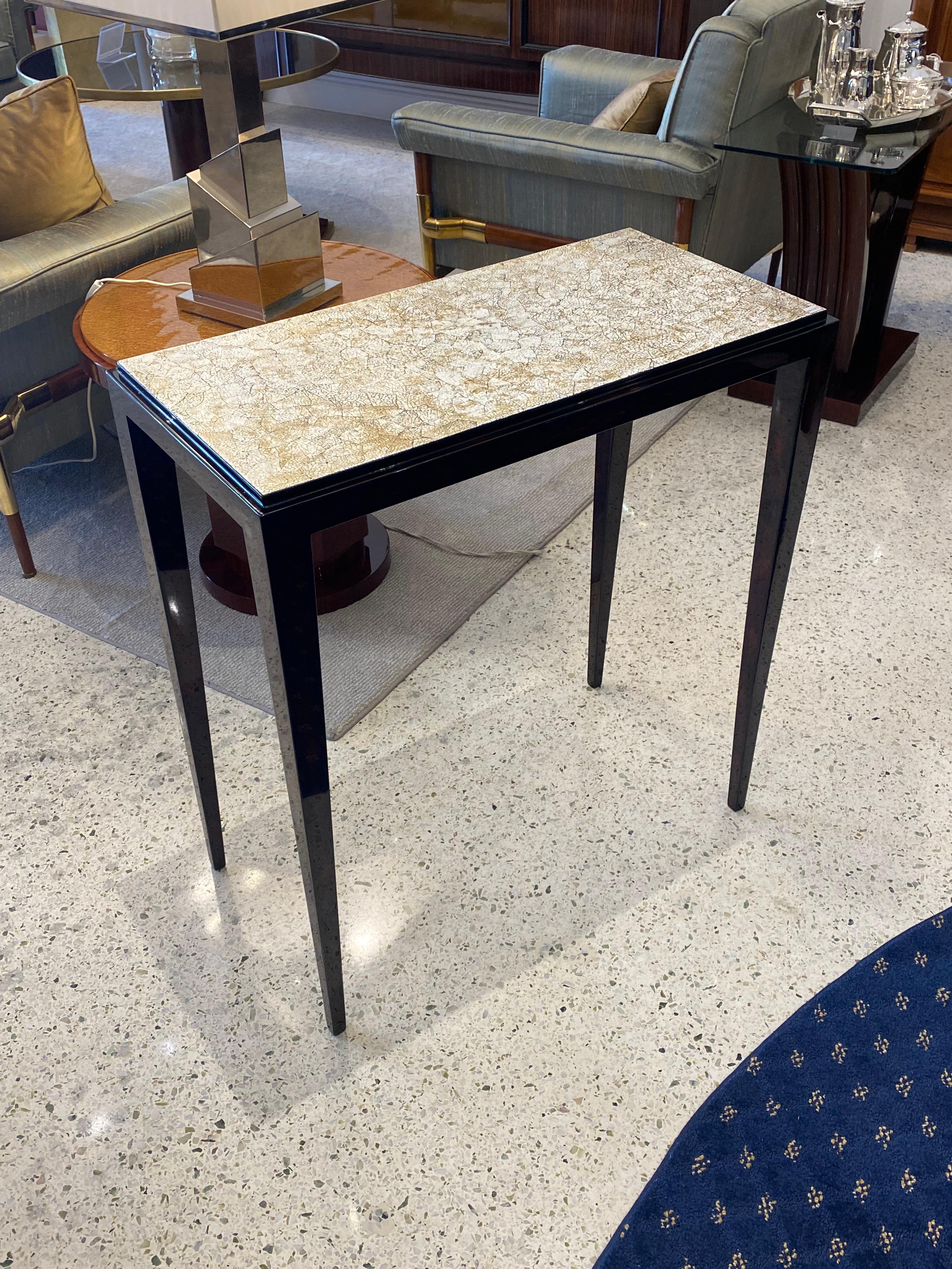 A beautiful lacquered side table with Eggshell top signed Maurice Tuizat.