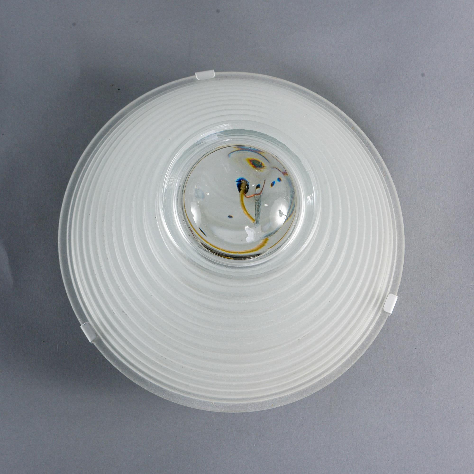 Industrial style flushmount light by Angelo Mangiarotti for Artemide of Italy, circa 1970. Thick, sandblasted ridged and graduated glass shades have a center magnifying lens. New wiring for US electrical standards.
 