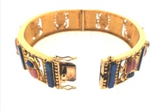 Egiptian Revival 18 Karat Yellow Gold Bangle with Rhodochrosite and Lapis Lazul