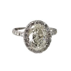 Used EGL 1.41 Carat Oval Diamond Set in Halo Wedding Set