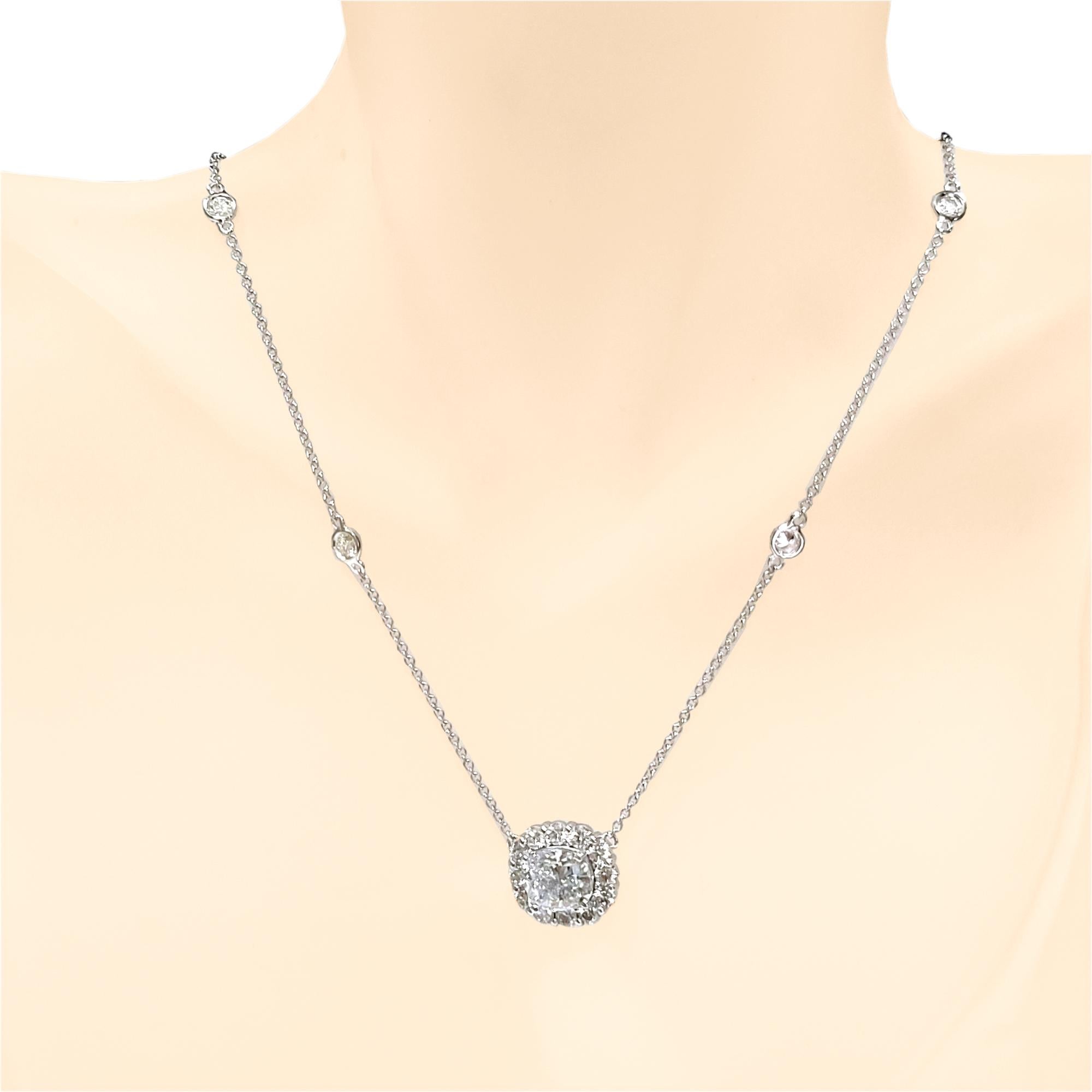 A D/SI3 EGL Certified 2.03 Ct Cushion Modified diamonds sits in the center of a Beautiful  handcrafted Pendant with halo set with 12 Perfectly matched Round Brilliant Diamonds. It sits on a  diamond by the yard necklace with 4 bezel set Round