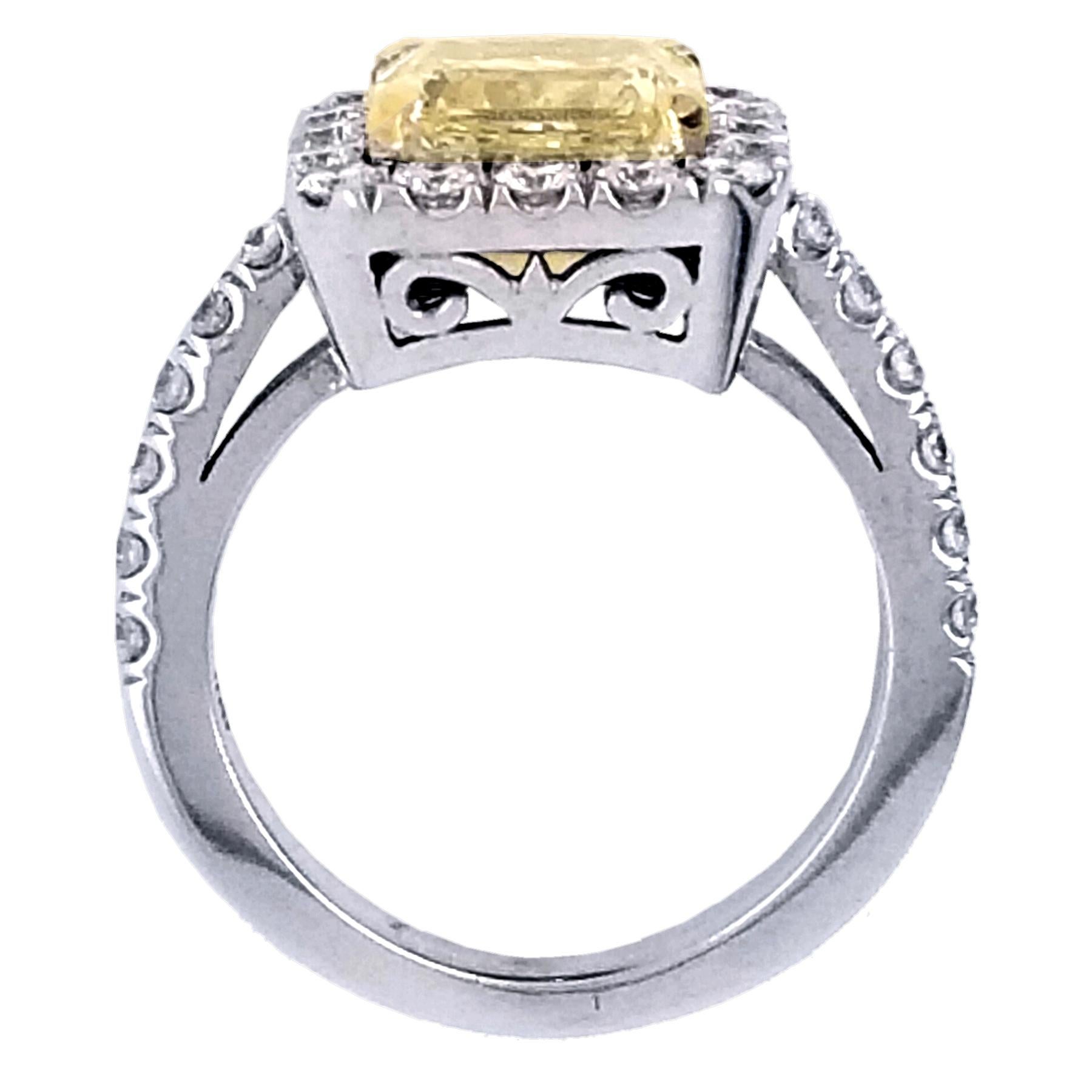 Contemporary EGL 2.49 Ct Fancy Light Yellow Radiant Pave Set 18K Engagement Ring with Halo For Sale