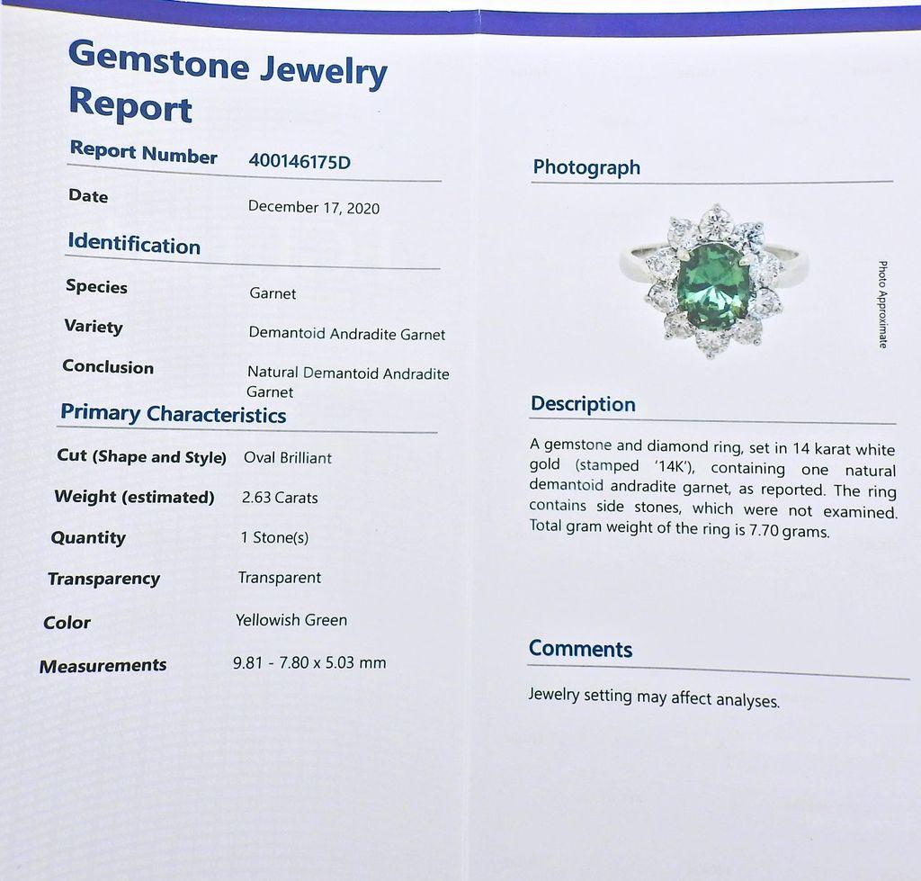 EGL certified 2.63ct Russian Andradite demantoid garnet, set in 14k gold ring, surrounded with approx. 1.50ctw in H/VS diamonds. Ring size - 12, top of the ring - 18mm x 15mm. Weight - 7.7 grams. Marked 14k. 
