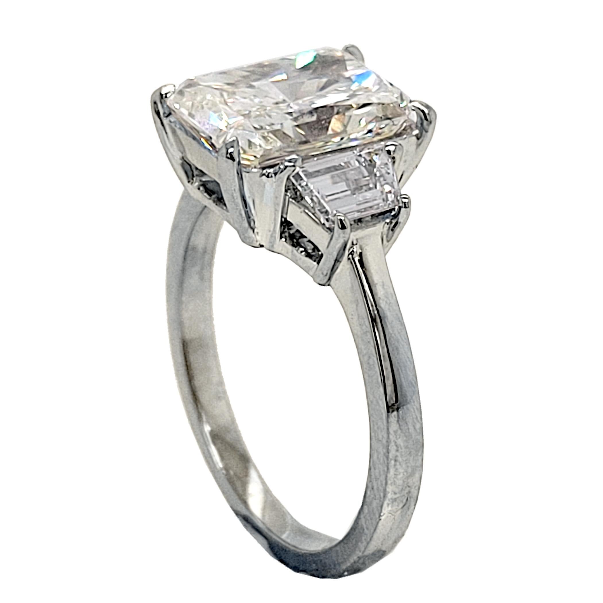EGL 3.02 Ct H/VS2 Radiant Diamond Platinum 3-Stone Engagement Ring w. 2 Traps In New Condition For Sale In Los Angeles, CA