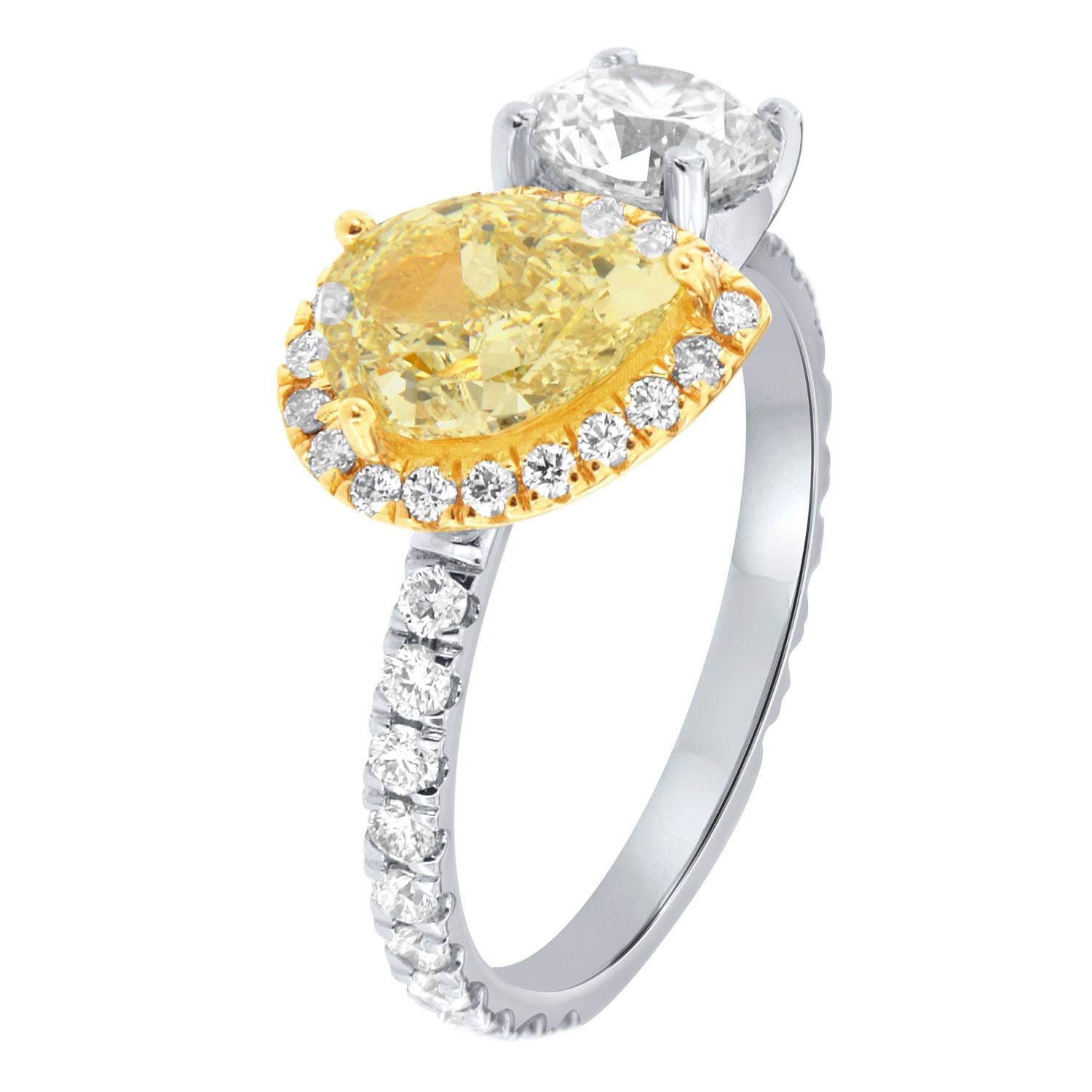 This stunning A-Symmetric ring features 1.51 Carat Fancy Yellow Pear shape diaomnd & a 0.88 Carat round-shape white diamond. Both are encircled by brilliant round diamonds on a 2 mm wide diamond band. The diamonds are micro prongs set on 3/4 of the