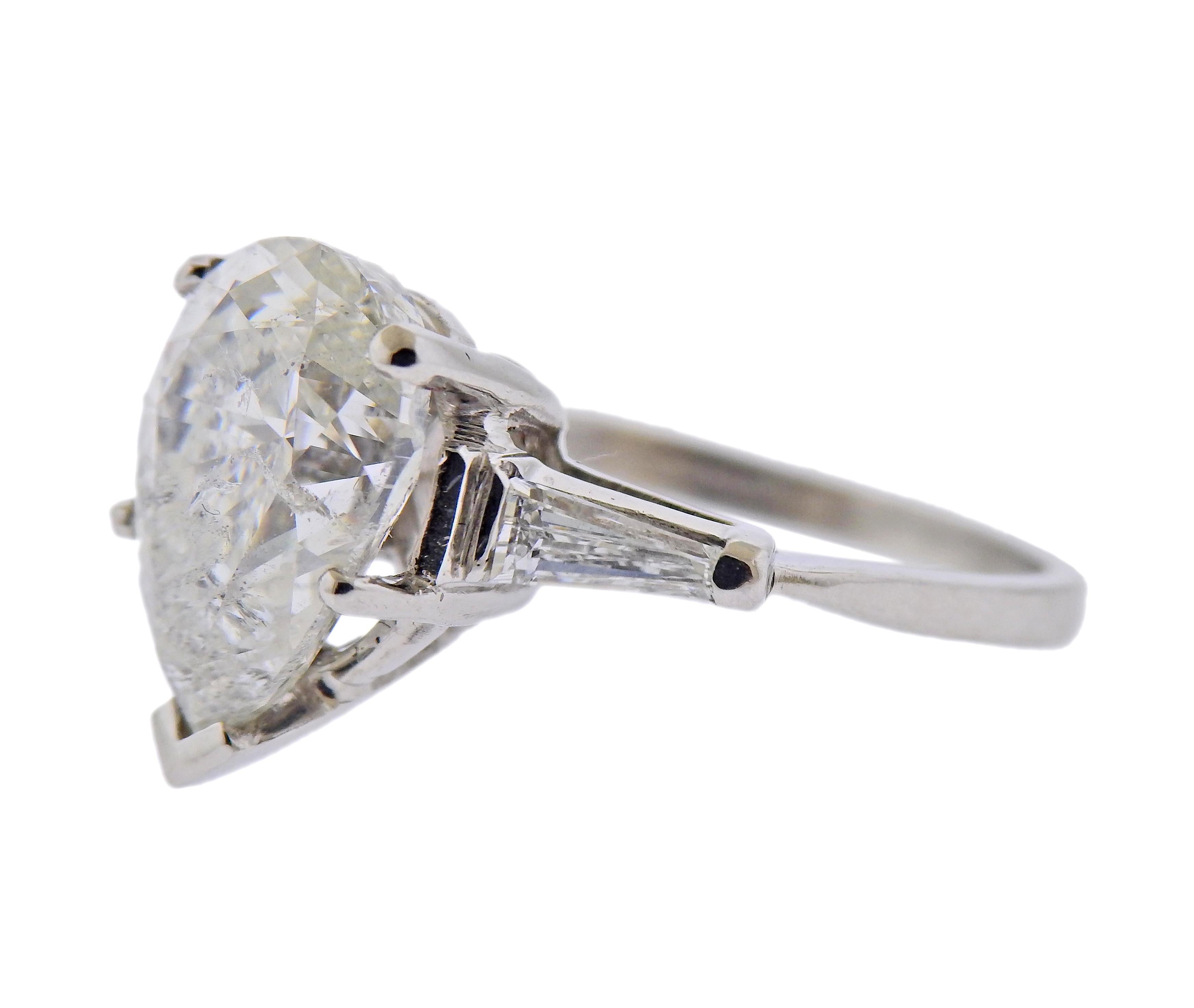 EGL certified 5.02ct pear shaped diamond G/SI2, set in platinum ring, with two side tapered baguetttes. Ring size 6. Center stone measures approx. 11.55 x 8.8 x 6.8mm.  Weight - 5.1 grams. 