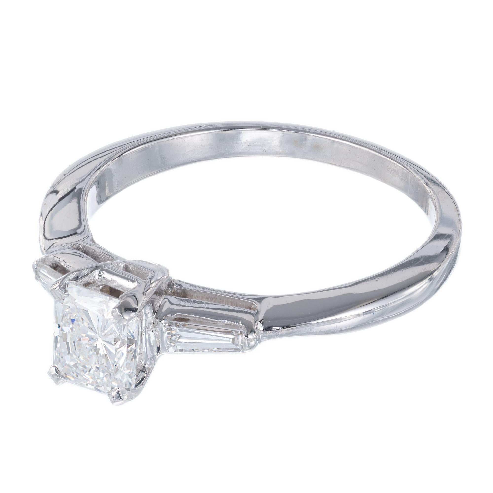 Cushion cut diamond engagement ring. EGL certified .65cts center stone in a 14k white gold three stone setting with 2 baguette side diamonds. 

1 Cushion cut .65ct diamond F to G color and SI2 clarity,  EGL certificate# US65285401D
2 tapered