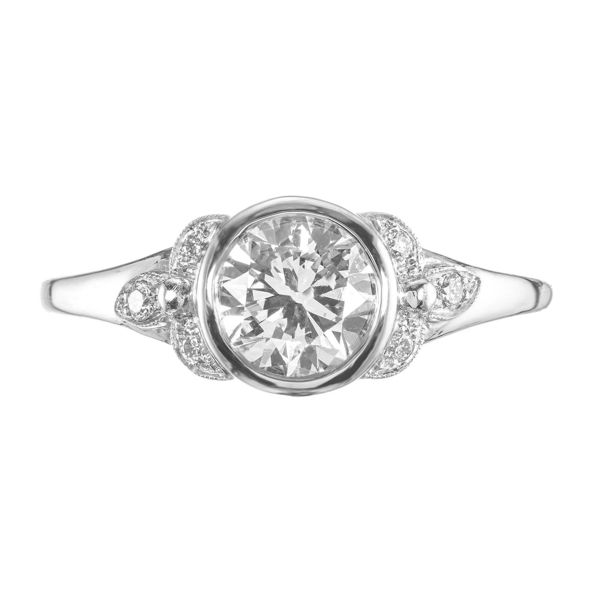 Step back in time to the 1940's Art Deco era, with this exquisite diamond platinum engagement ring. A true piece of history waiting to adorn your finger. The center stone is a 1.00ct old European cut diamond, bezel set in a platinum setting. The