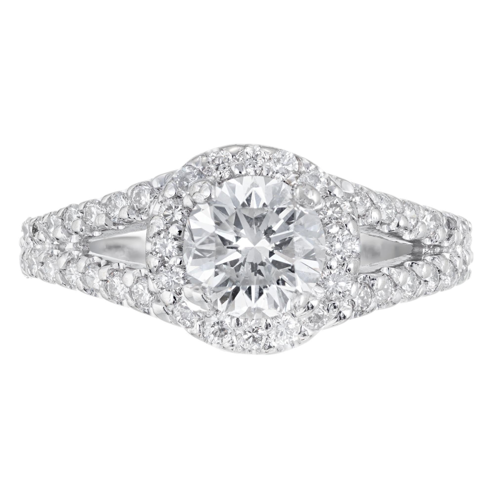 Diamond split shank engagement ring. EGL certified round center stone set in a 14k white gold Halo setting with 52 round accent diamonds.   

1 round diamond G-H SI2, approx. 1.02cts EGL Certificate # US312297802D
52 round diamonds H SI, approx.