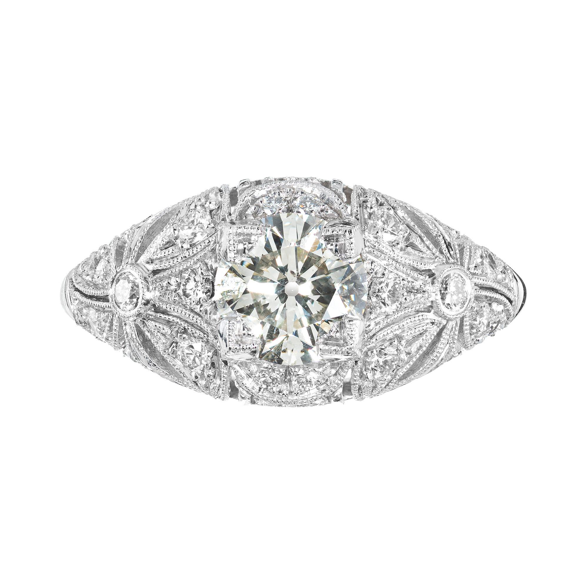 Early 1900's Victorian Diamond platinum engagement ring. Mounted with a transitional Ideal cut 1.03ct diamond. The dome crown is highly detailed with bow design sides, beautiful open work and adorned with 18 round diamonds. EGL certified as faint
