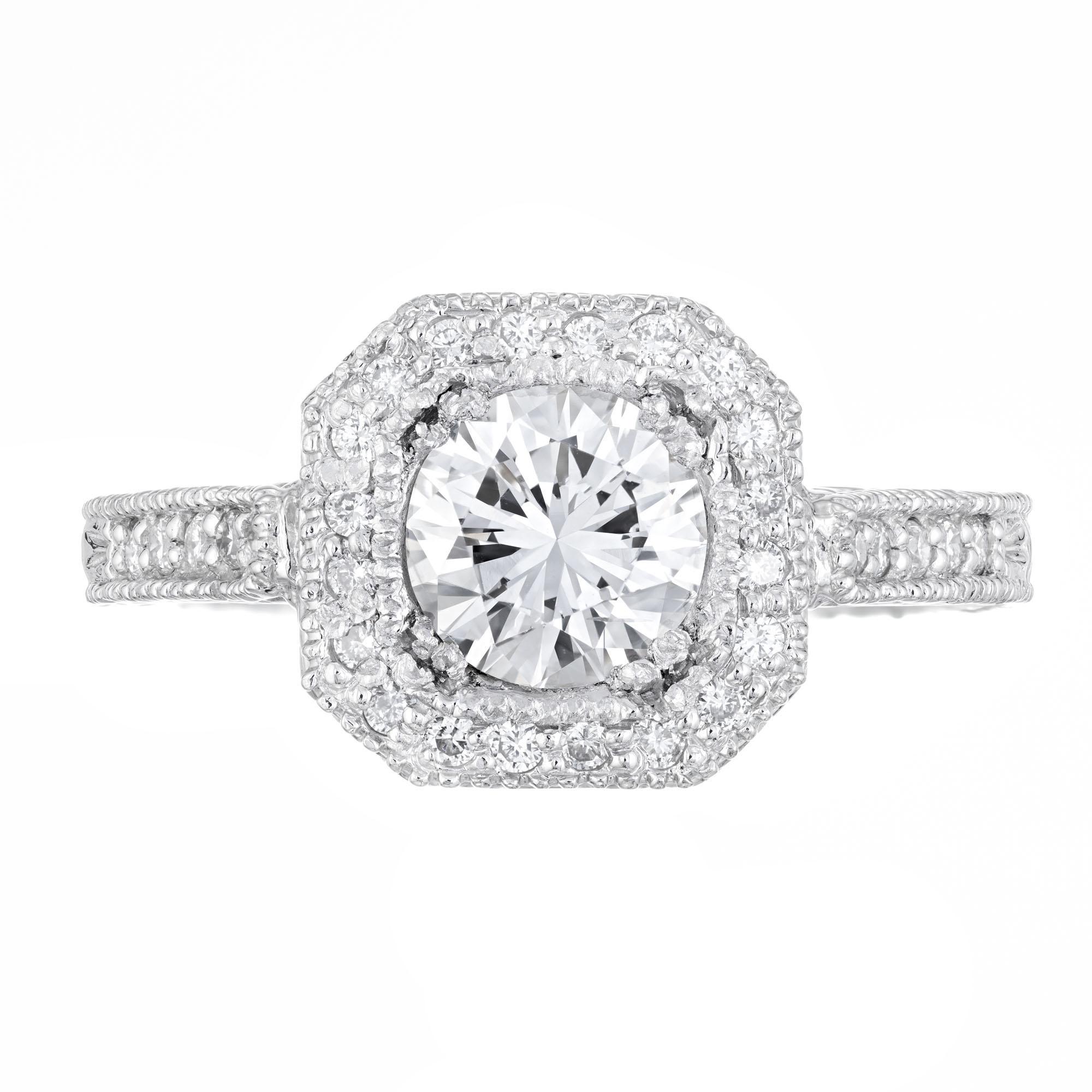 Diamond engagement ring. EGL certified center stone in a platinum halo setting with 60 round accent diamonds. 

1 round diamond G SI2, approx. 1.05cts EGL Certificate # US4553113D
30 round diamonds F VS, approx. .40cts
30 round Ideal diamonds F VS,