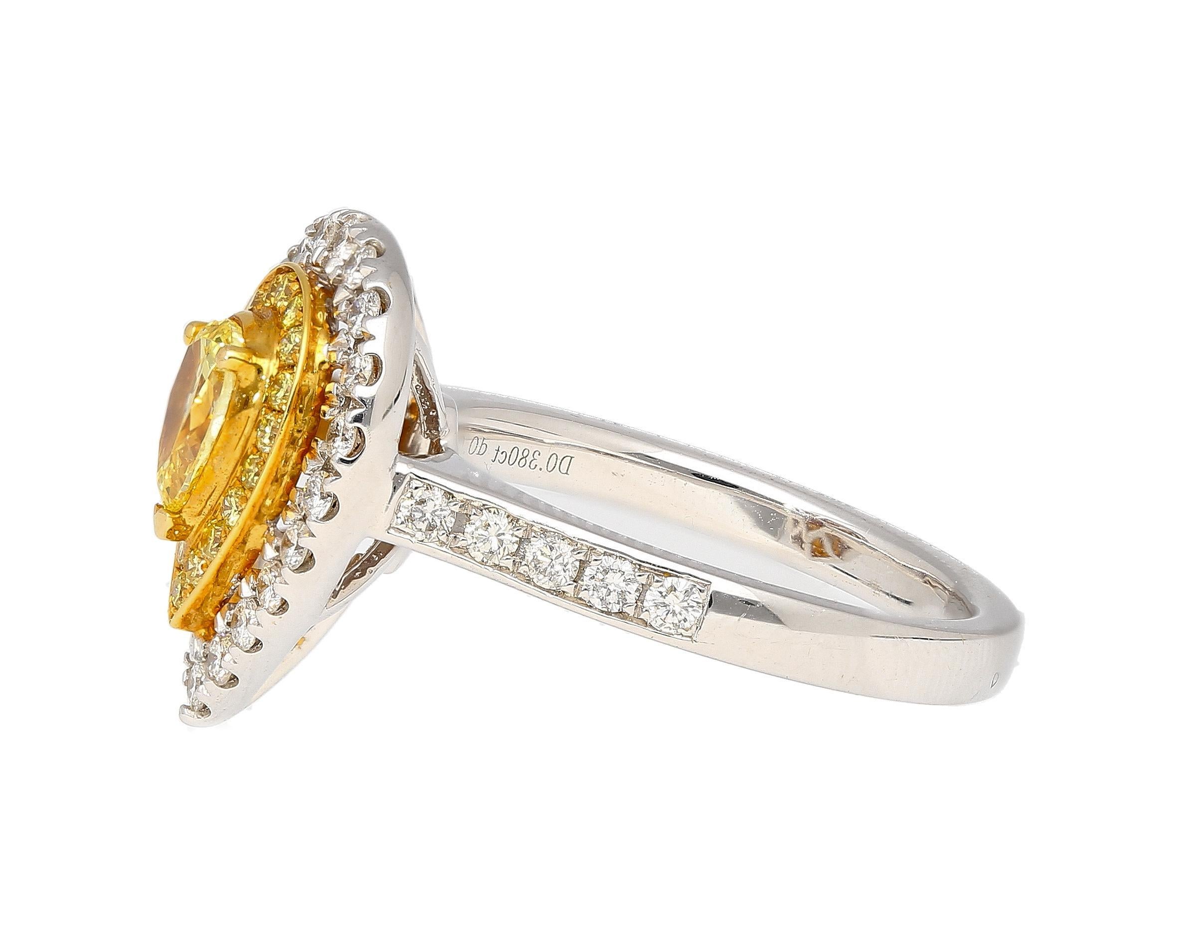 EGL Certified Fancy Vivid Yellow Pear Cut Diamond and Double Diamond Halo Two Tone Engagement Ring. 

Item Details:
- Type: Engagement Ring 
- Metal: 18K White, Yellow Gold 
- Weight: 6.40 grams 
- Setting: Prong 
- Ring Size:
