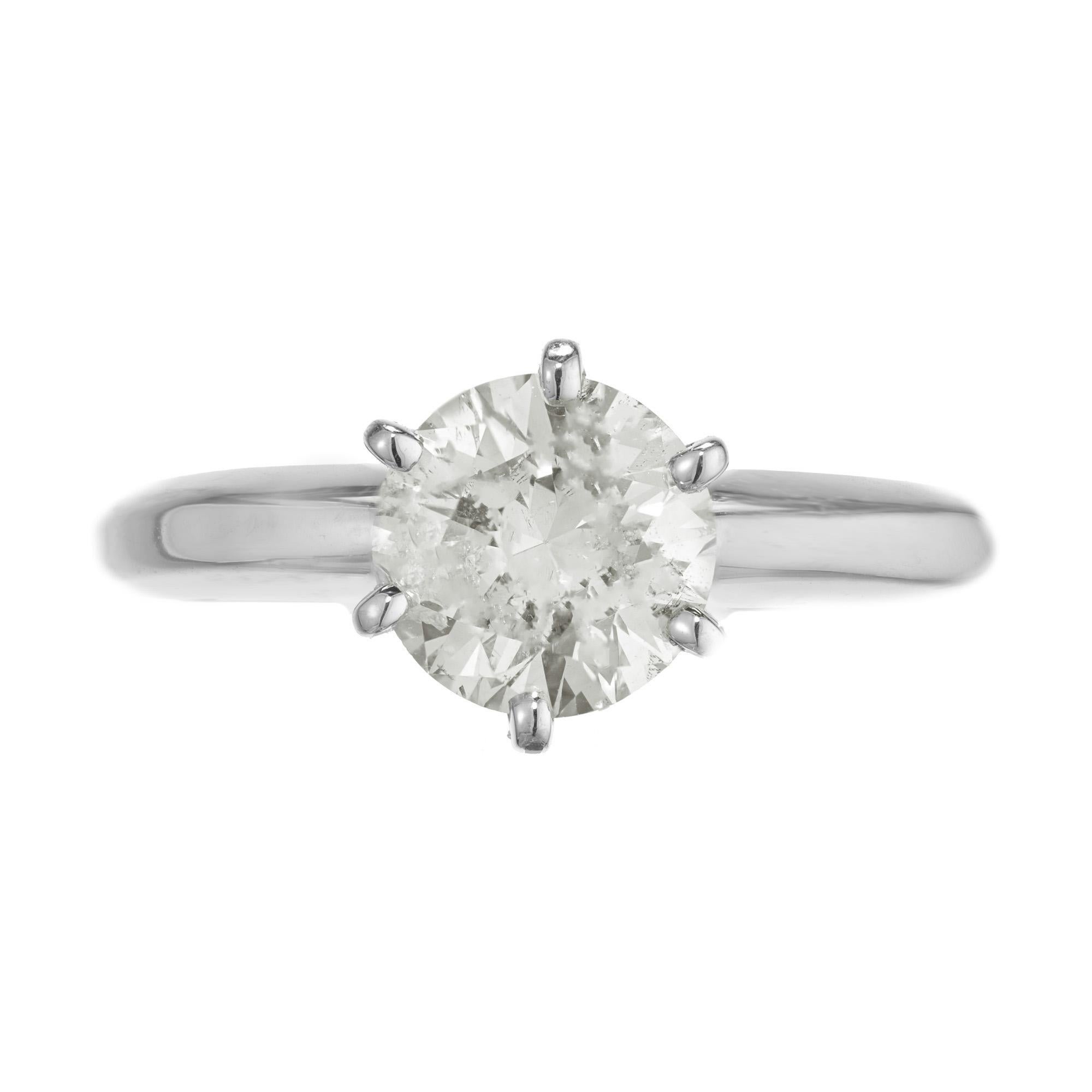 EGL certified diamond engagement ring. 1.10ct round cut diamond center in stone. Set in a Platinum solitaire six prong setting. This diamond has faint yellow coloring that is more expressive at certain angles that is hard to photograph. 

1 round