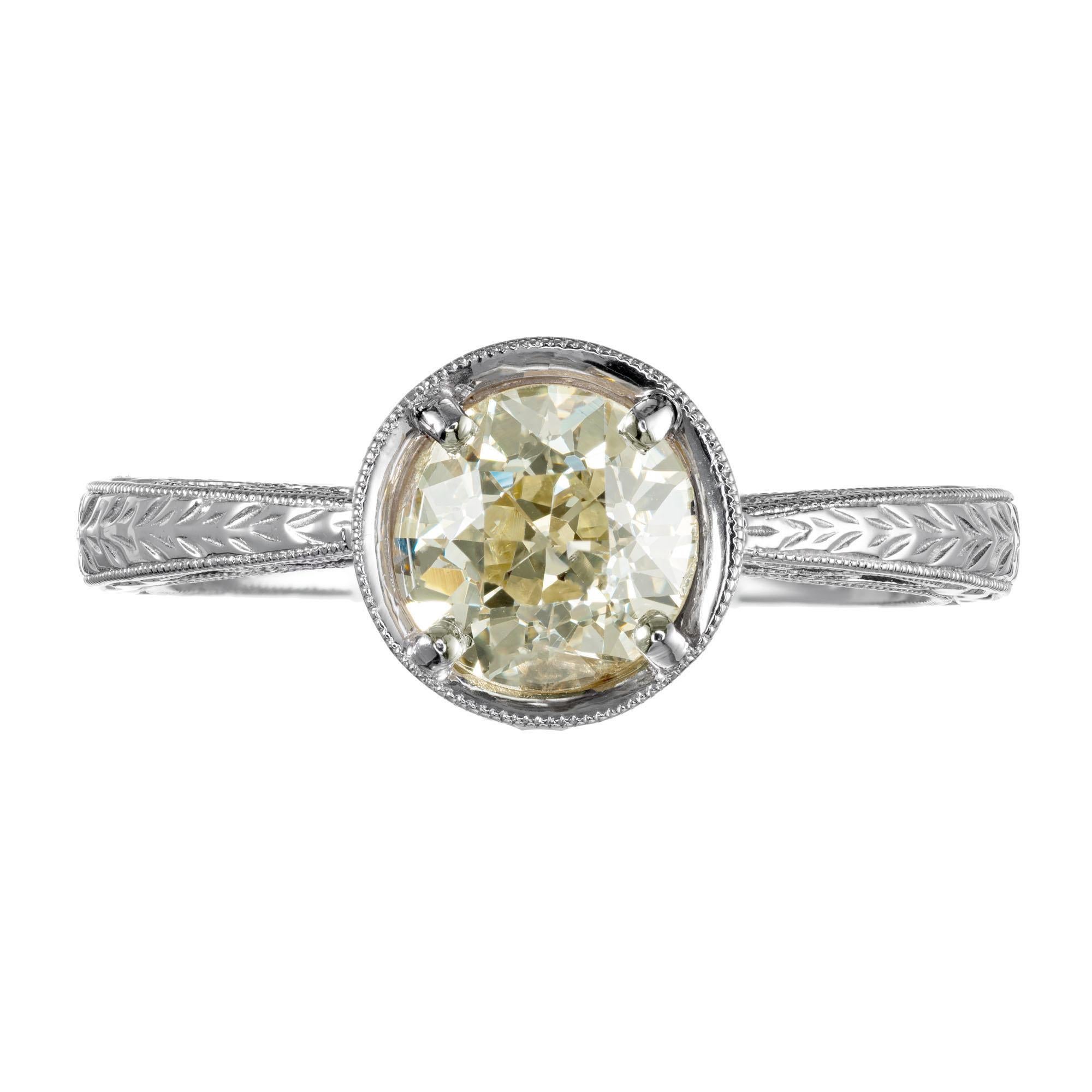 Soft light yellow Old European brilliant cut 1.11 carat diamond engagement ring. Circa 1900. EGL Certified light-yellow W to X natural color with extra sparkle from the raised crown and small table on the Old European center stone, in a 14k white