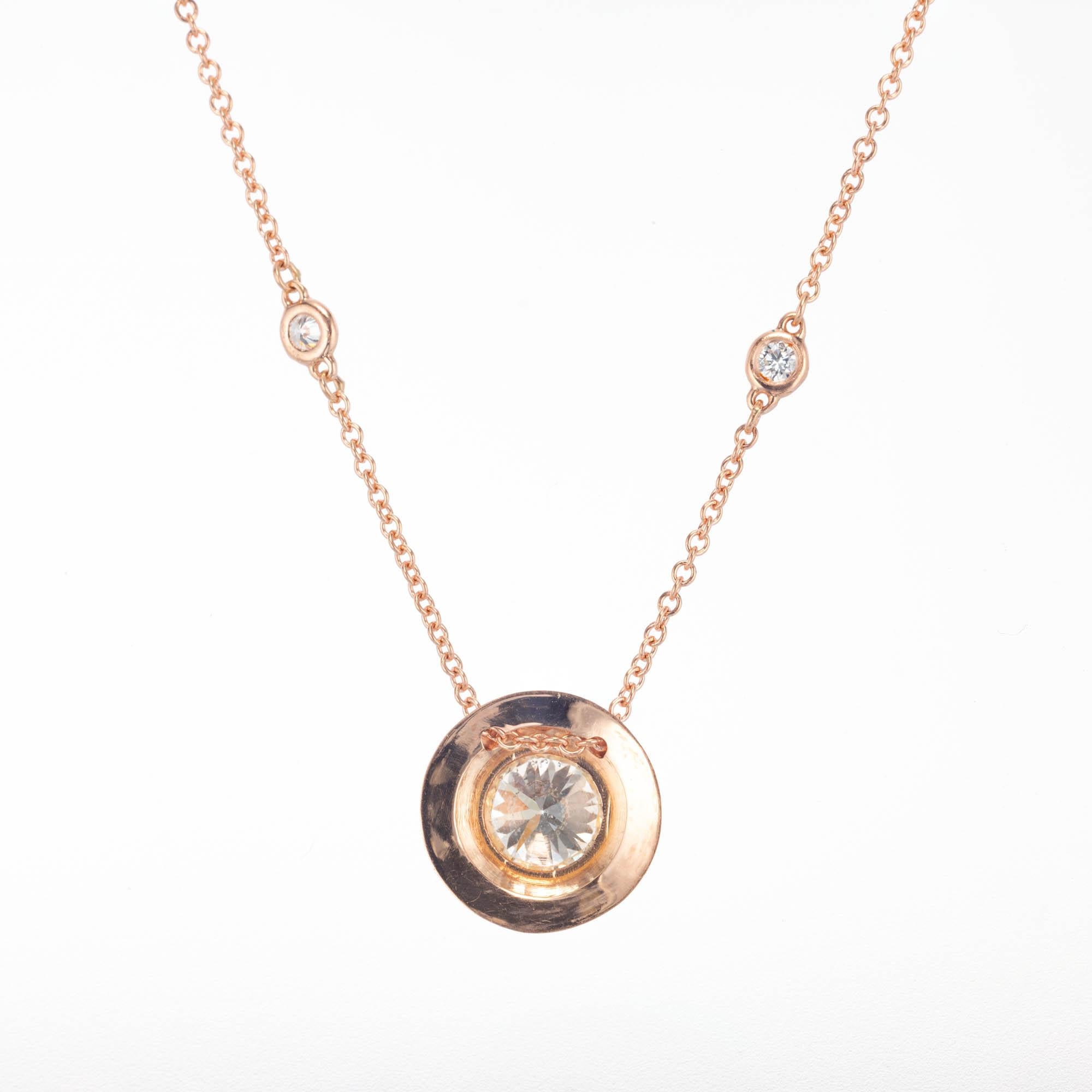 Bezel set diamond halo pendant in 14k rose gold on a diamond by the yard style chain. EGL certified 

1 round brilliant cut J-K SI diamonds, Approximate 1.15 Carat. EGL Certificate # US400115221D
6 round brilliant cut H-I VS-SI diamonds, Approximate